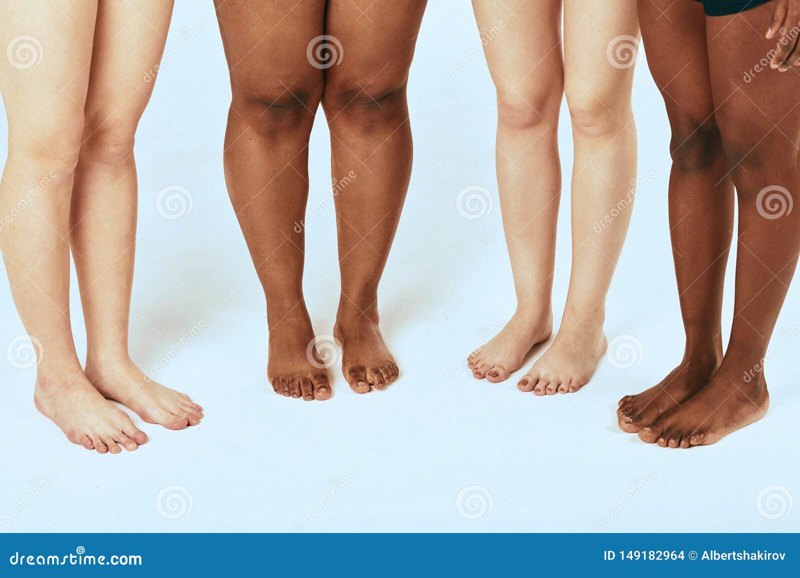 Female Leggs of Different Ethnicity and Size Over White Background