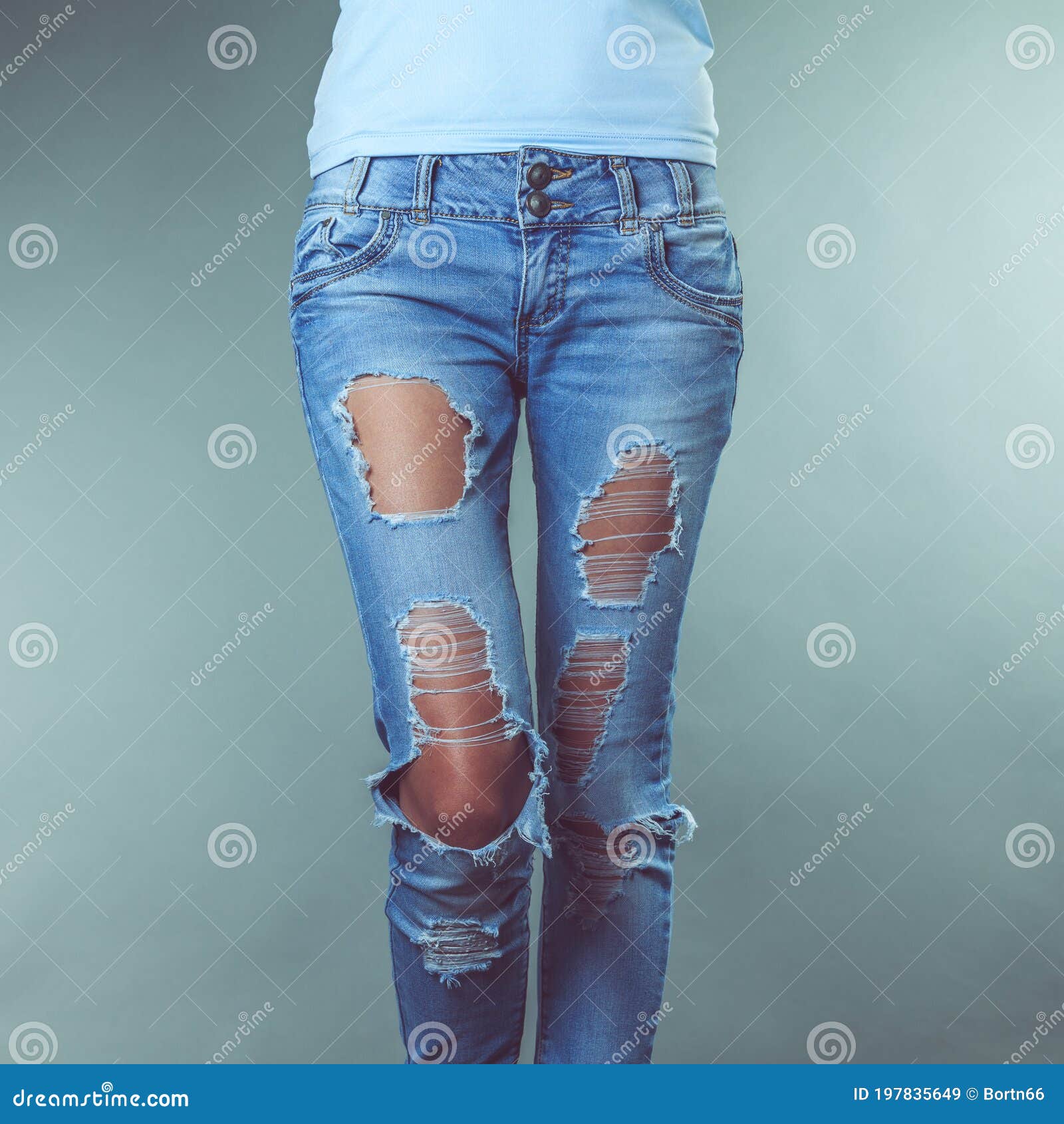 Female legs in torn jeans stock image. Image of legs - 197835649