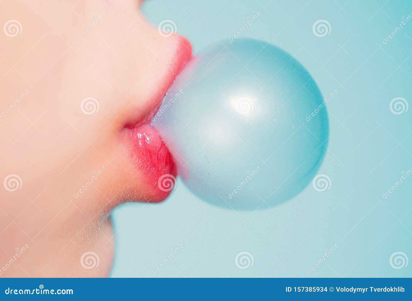 Female Lips Blowing Bubble Gum Close Up Of A Woman Face