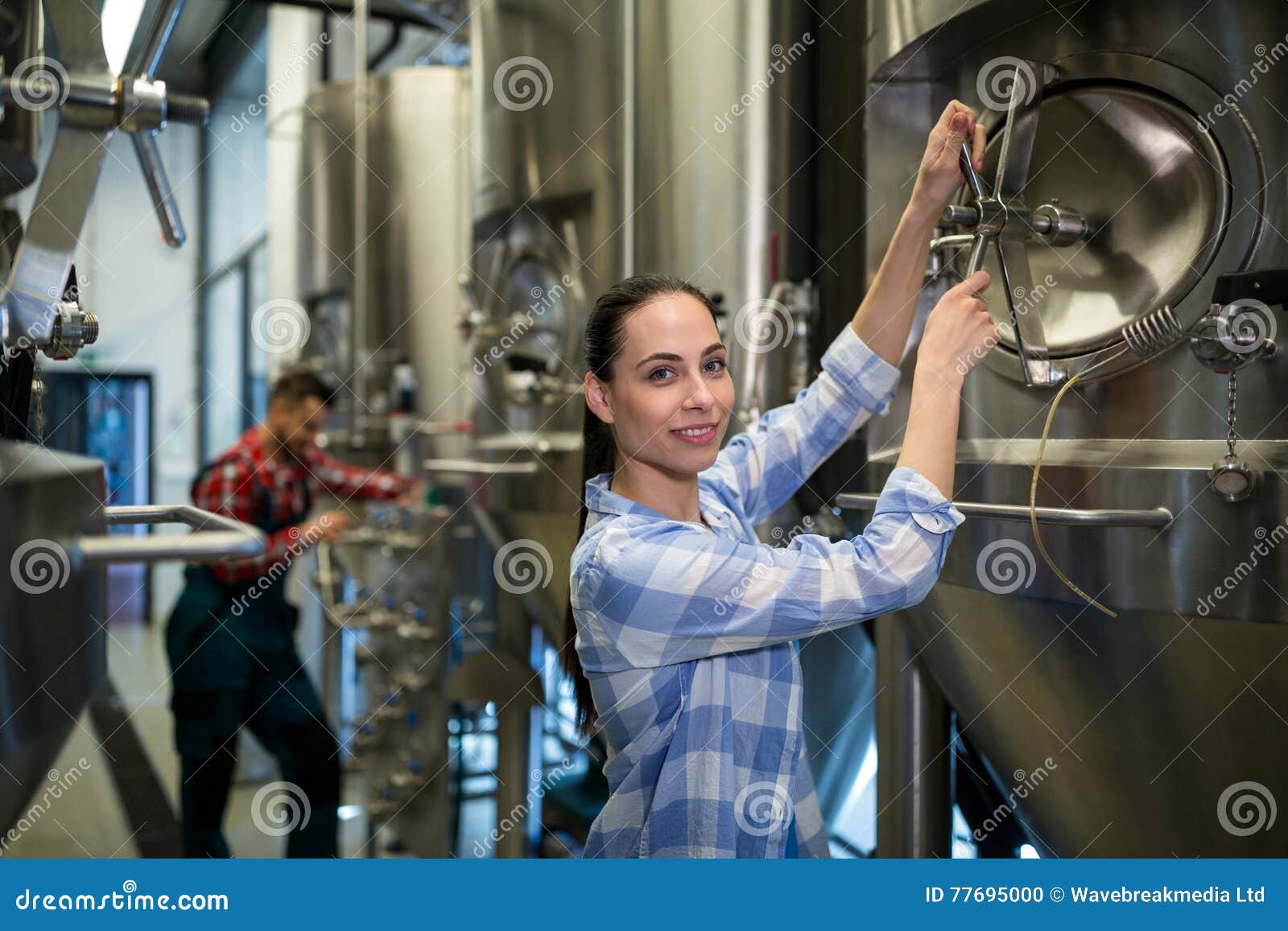 Female Maintenance Worker Examining Brewery Machine Stock Photo Image