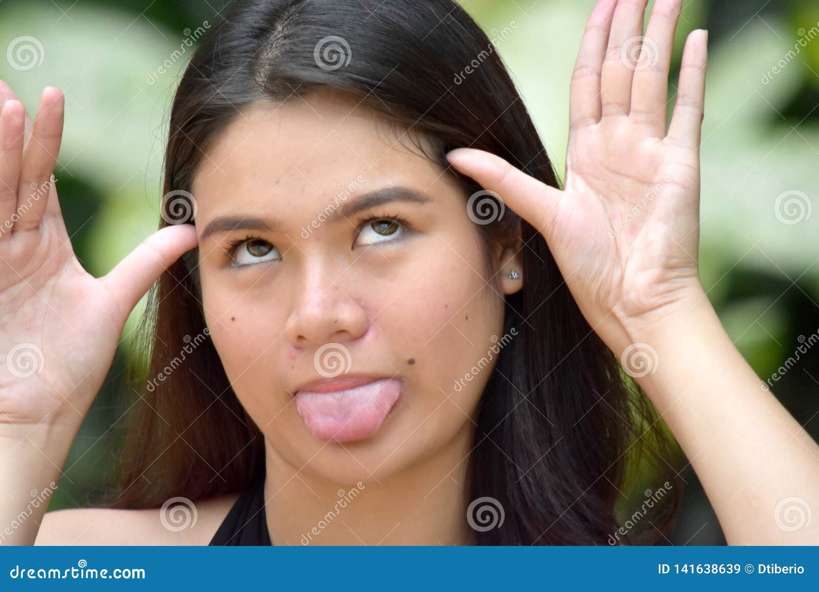 Female Making Funny Faces stock image. Image of funny 141638639