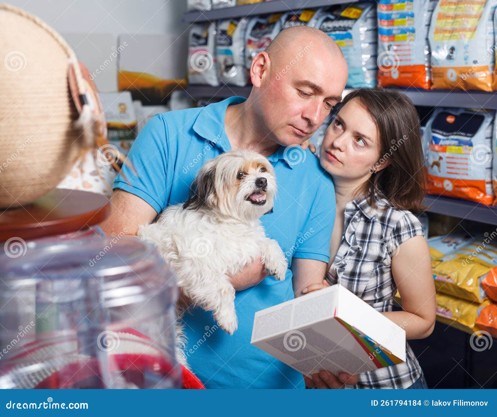 Female and Male with Dog Selecting Vet Food Stock Photo Image of