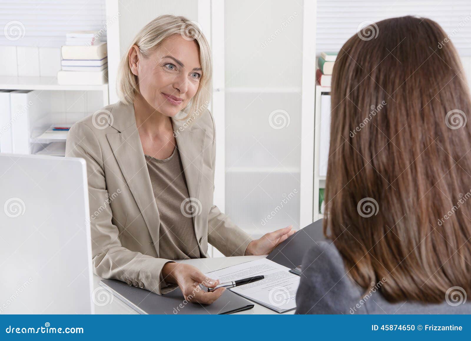 female managing director in a job interview with a young woman.