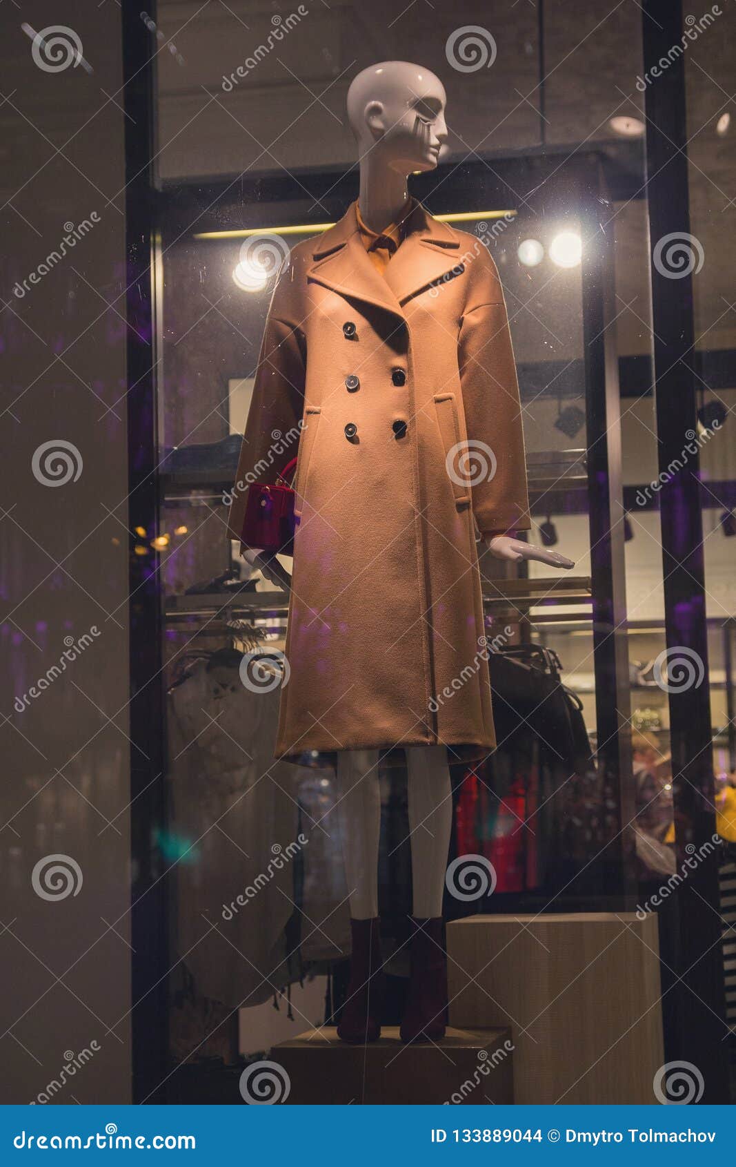 Female Mannequin in Coat in a Shop Window Stock Photo - Image of glass ...