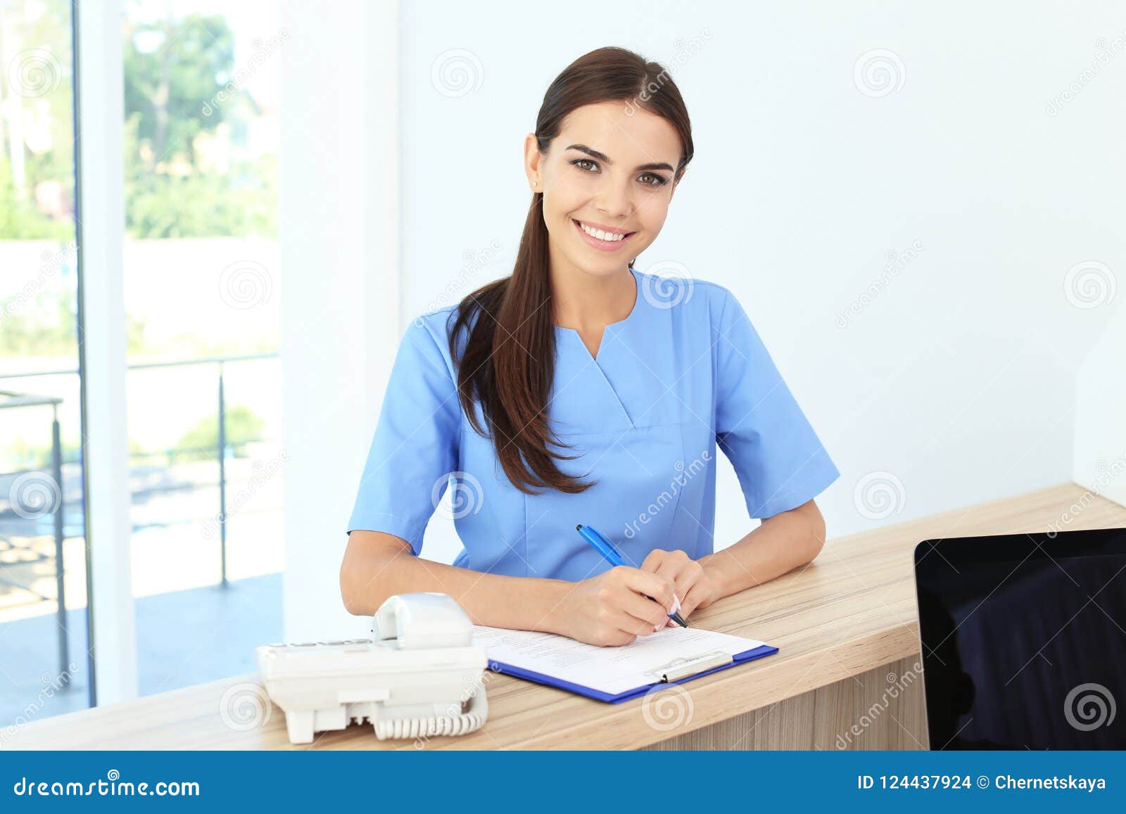 female medical assistant at workplace in clinic