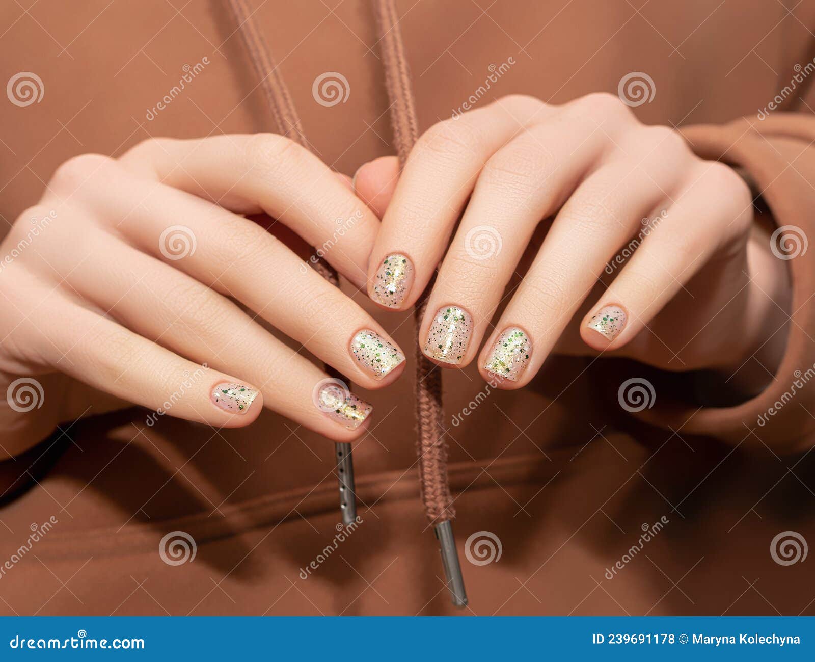 Female hand with long nails and a bright red manicure holds a bottle of nail  polish Stock Photo - Alamy