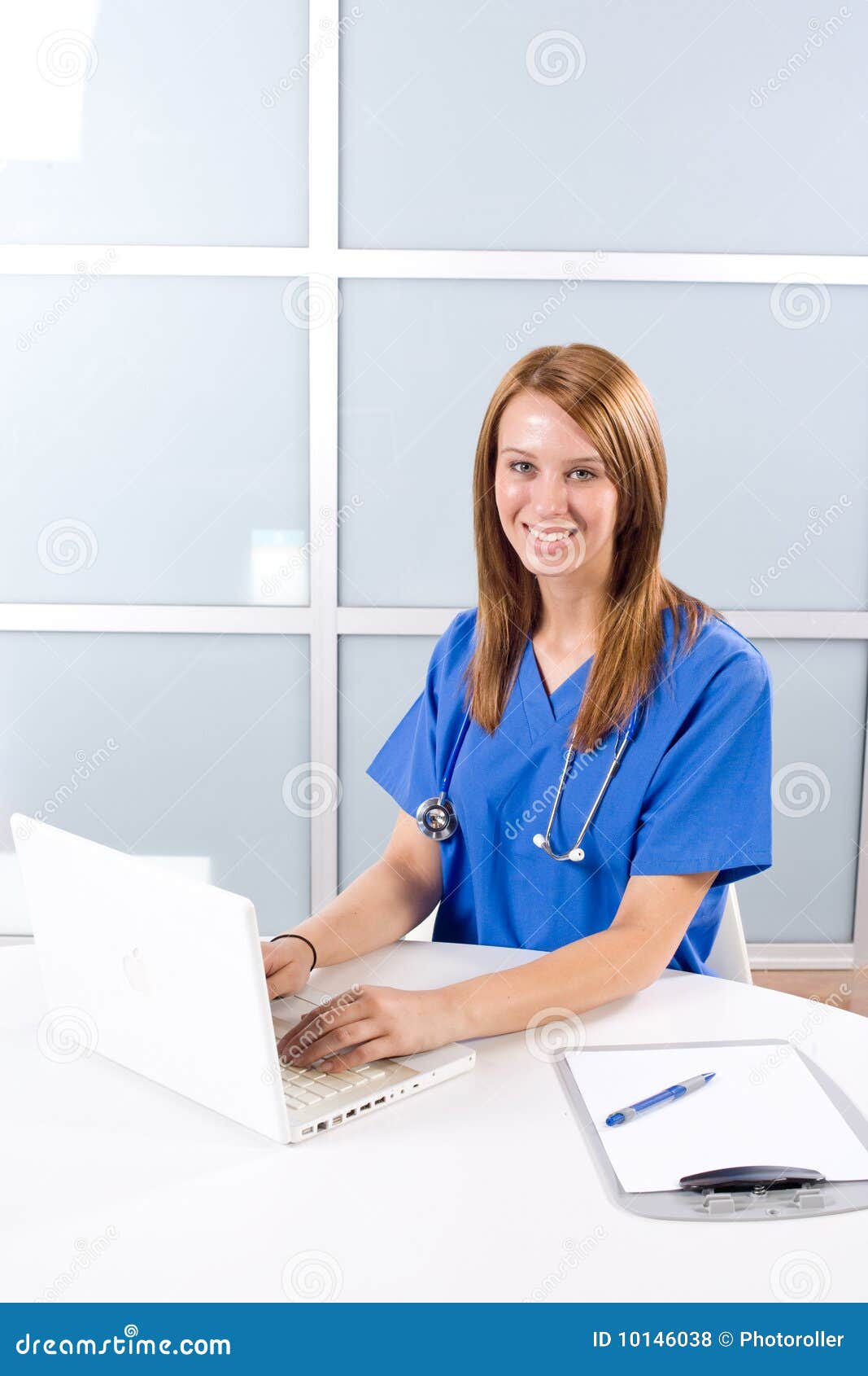 Female nurse at a desk stock photo. Image of holding 10146038
