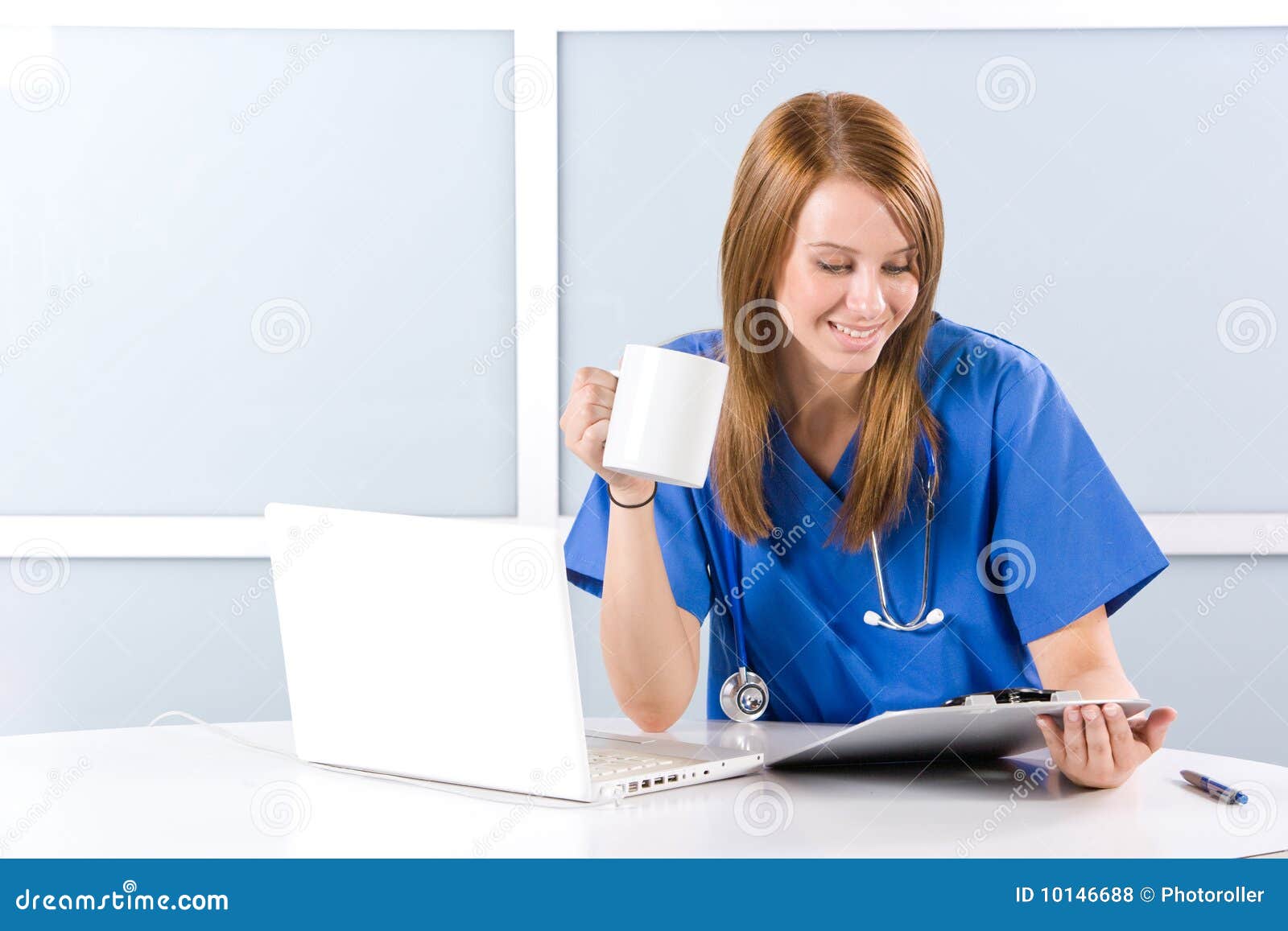 Female nurse at a desk stock photo. Image of medical 10146688