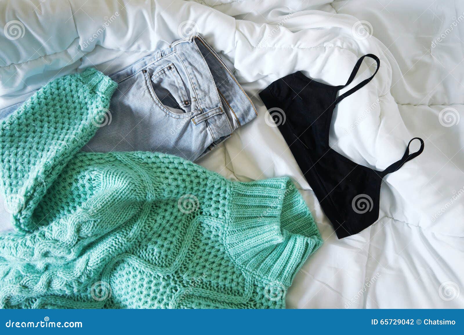 Female Outfit Laid Out on Bed Stock Photo - Image of concept, shirt ...