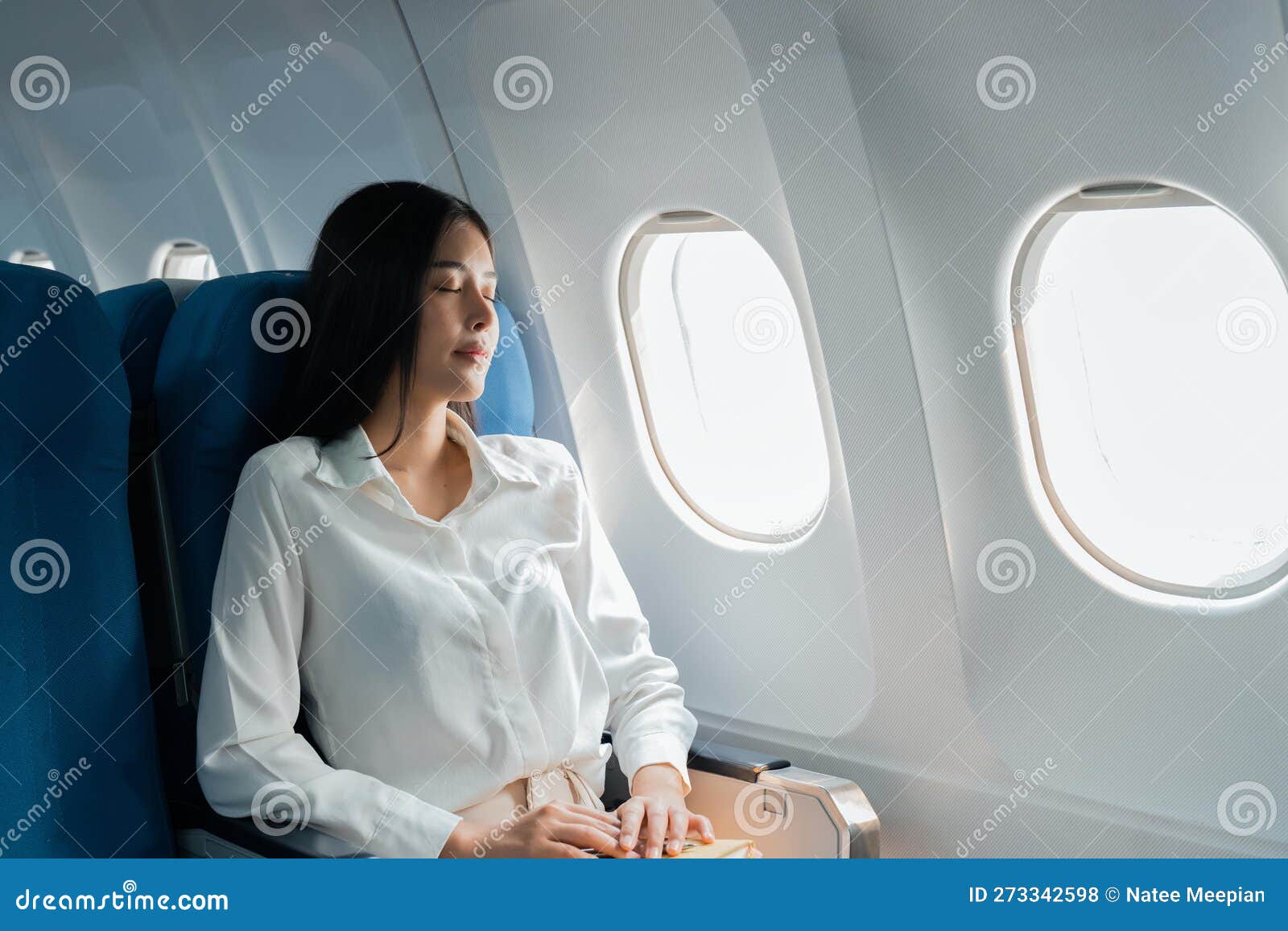 A Female Passenger Traveling by Plane Sleeping on Cushion Airplane Stock  Photo - Image of inside, person: 273342598