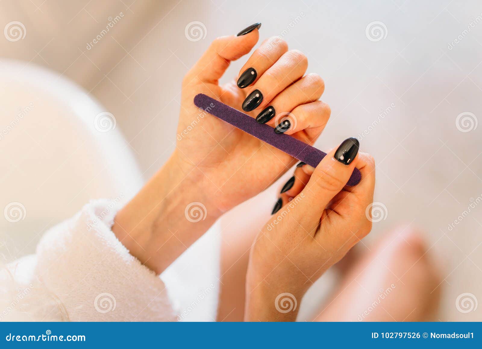 female person hands with nail file, manicure