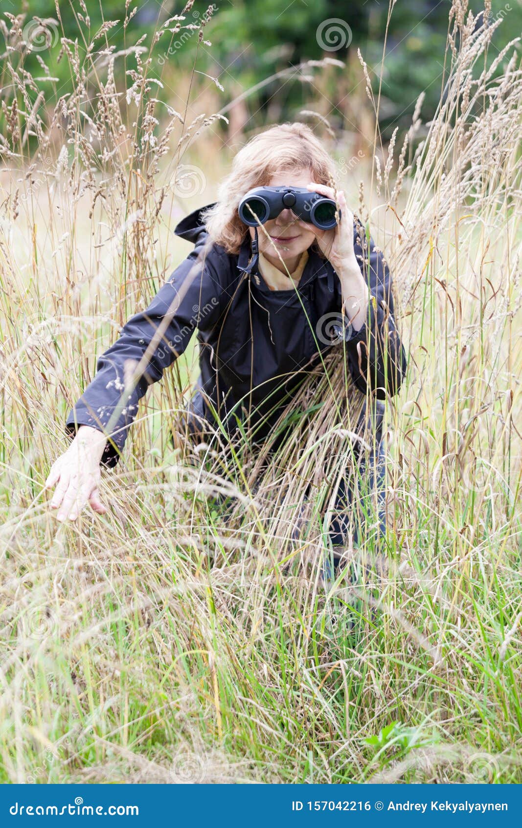 Female Person Observes Birds in Their Natural Surroundings As a Hobby ...
