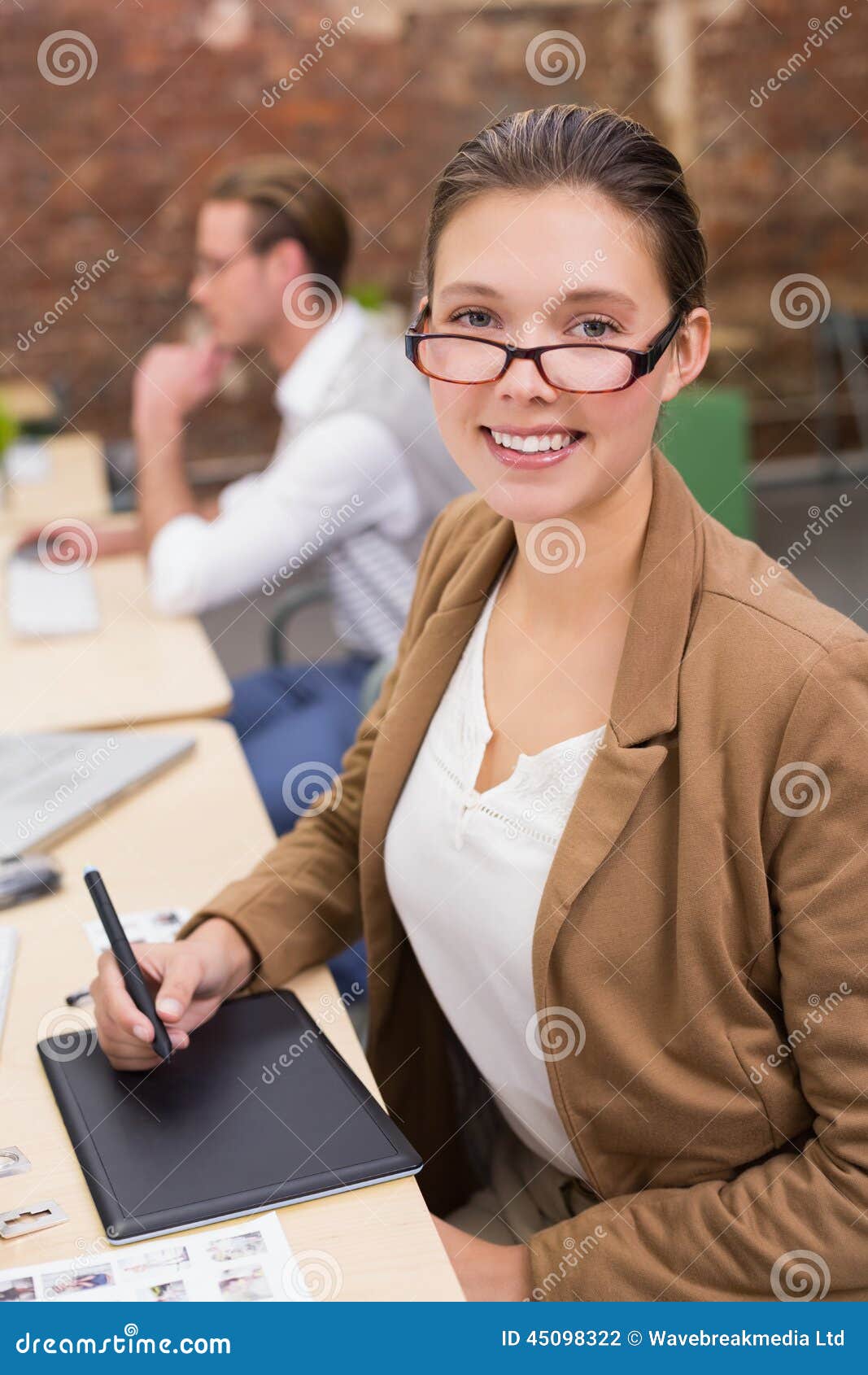 Female Photo Editor Using Digitizer in Office Stock Photo Image of
