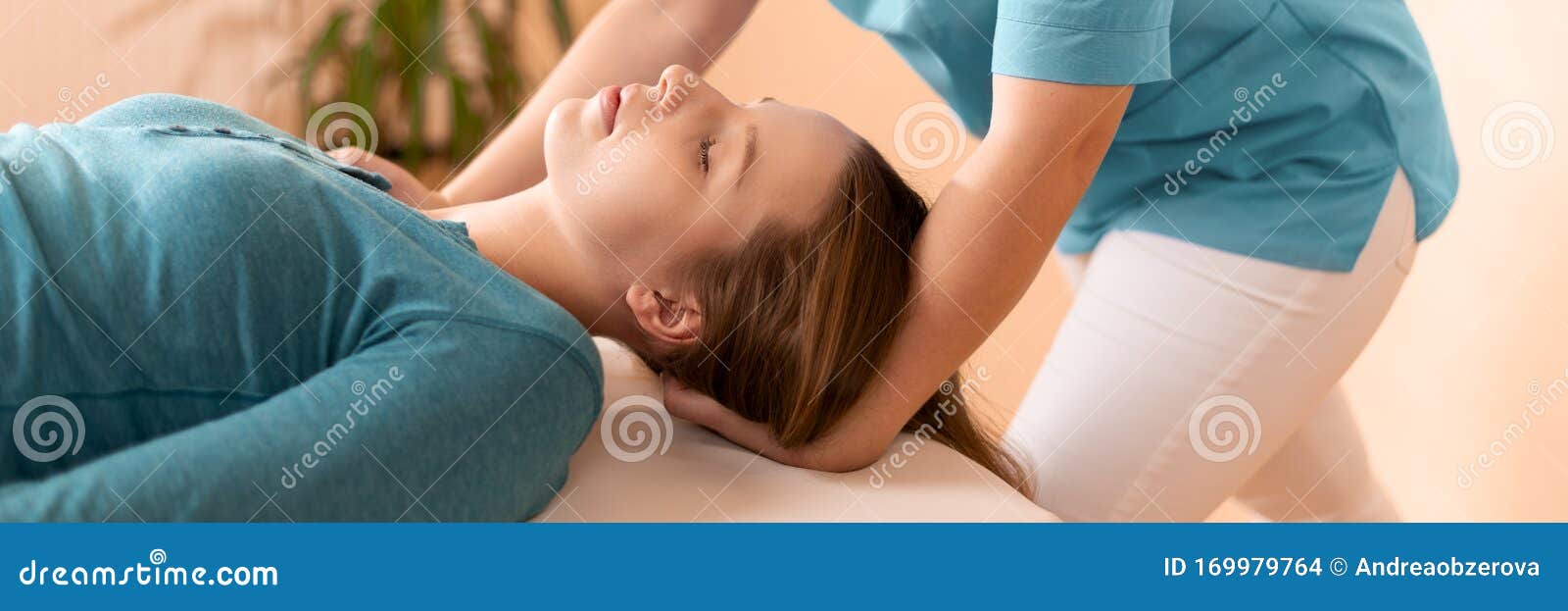 female physiotherapist or a chiropractor adjusting patients neck. physiotherapy, rehabilitation concept. cropped shot banner.