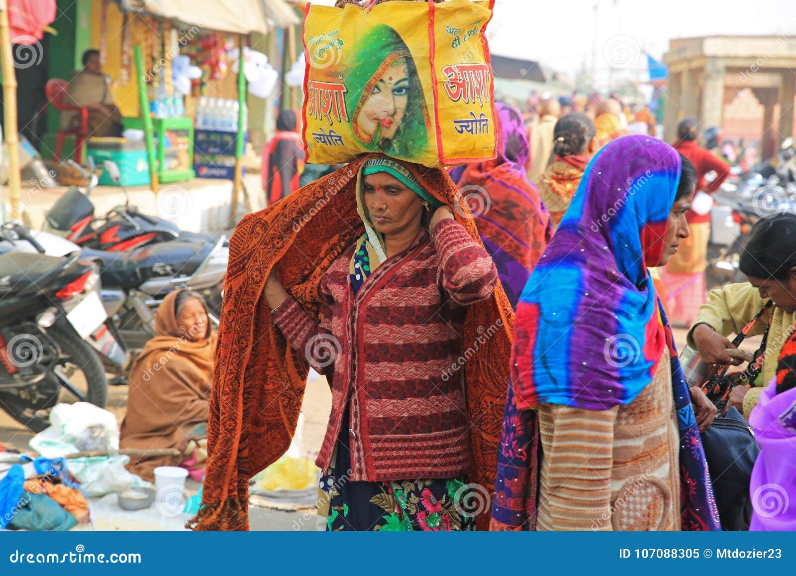 Female Pilgrim Carrying Bundle On Her Head On Pilgrimage