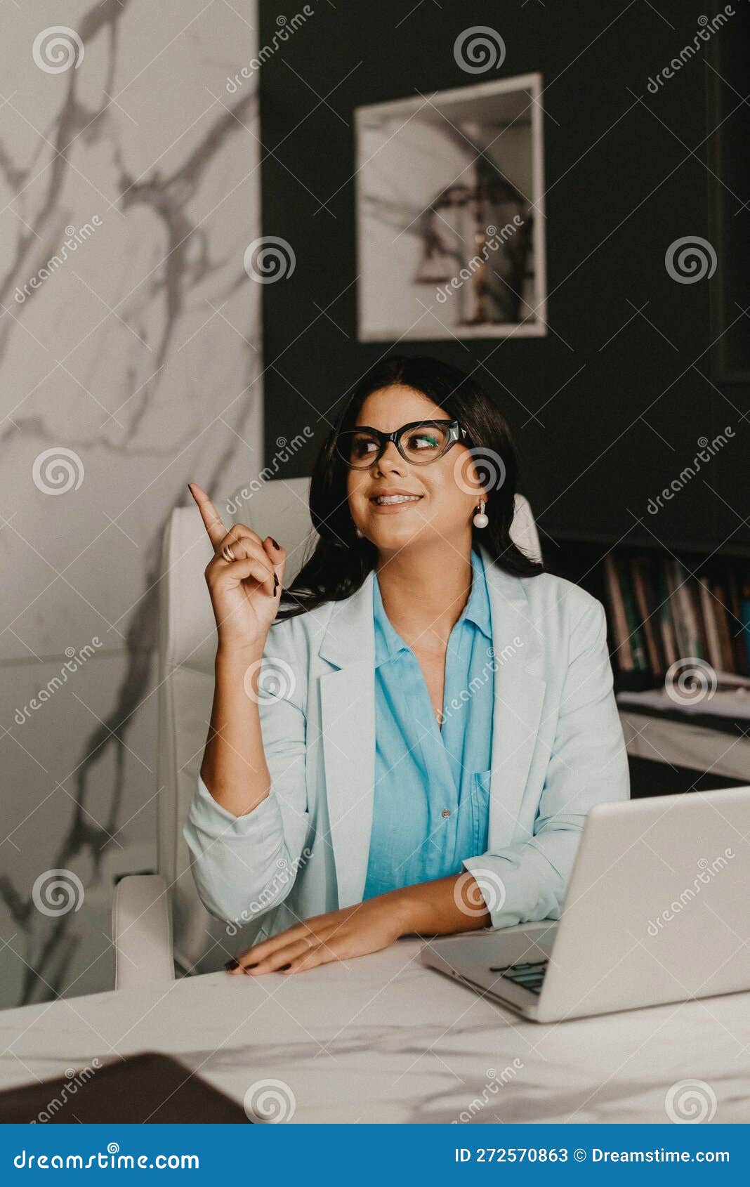 Female Professional at Her Home Office, Smiling with Contentment Stock