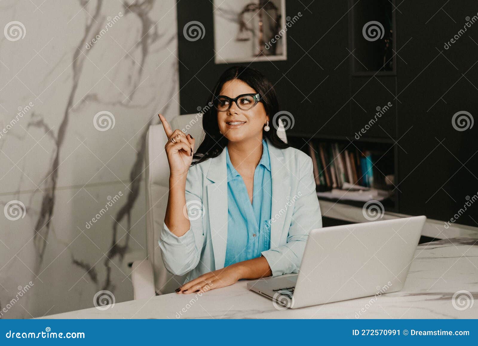 Female Professional at Her Home Office, Smiling with Contentment Stock