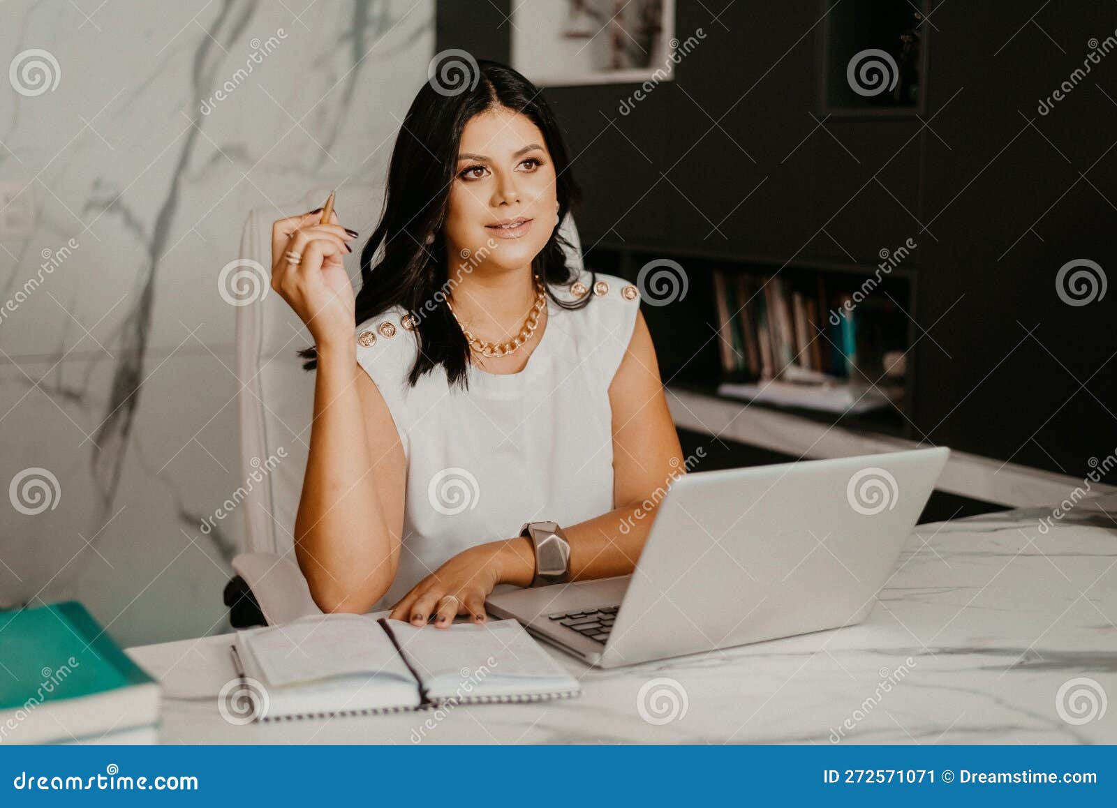 Female Professional at Her Home Office, Smiling with Contentment Stock