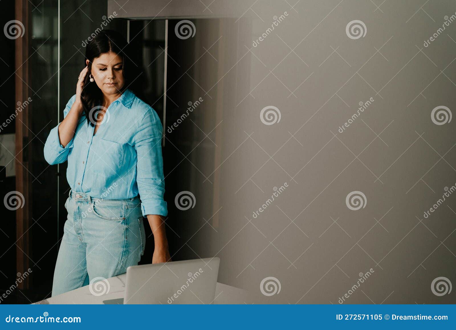 Female Professional at Her Home Office, Smiling with Contentment Stock