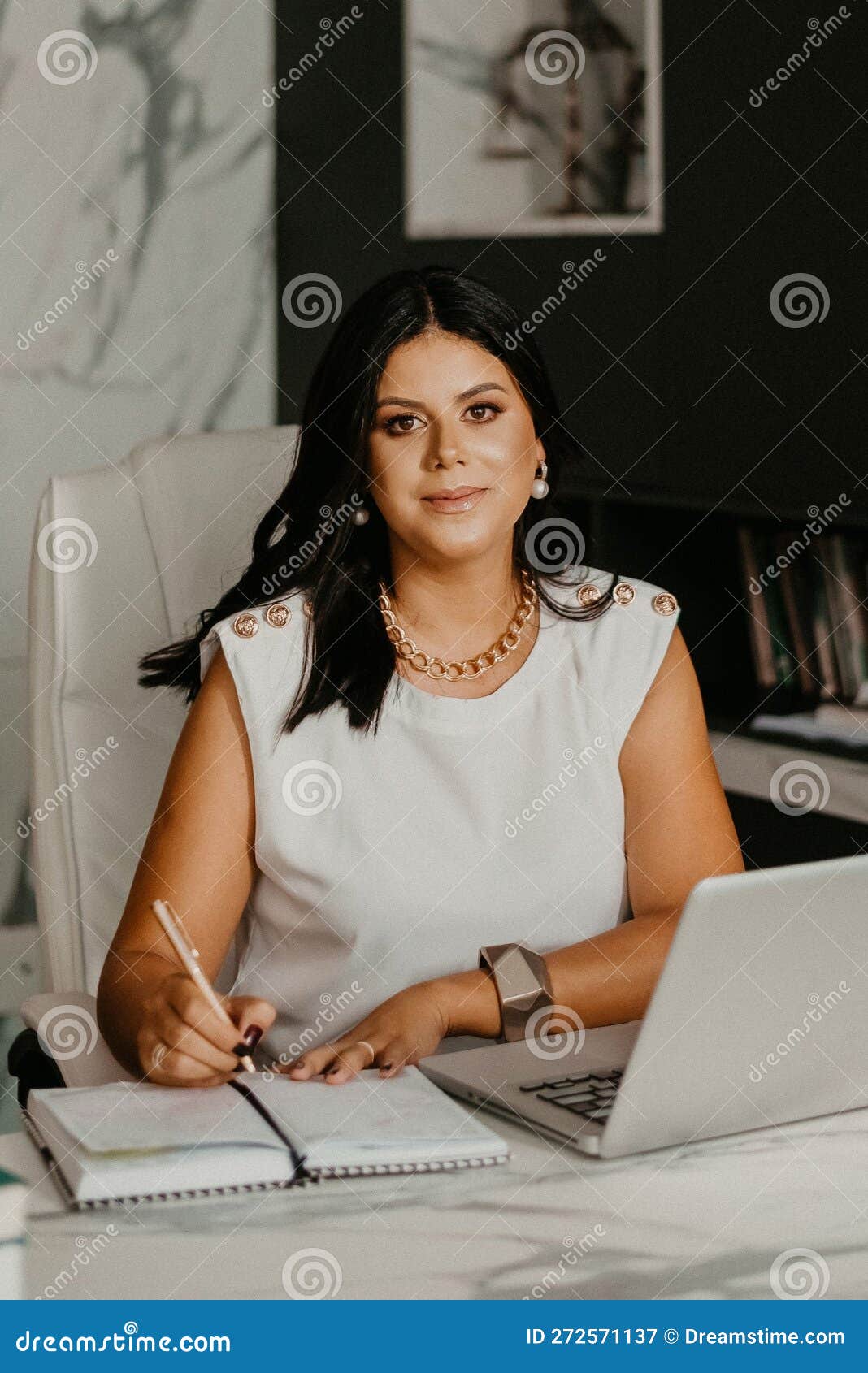 Female Professional at Her Home Office, Smiling with Contentment Stock