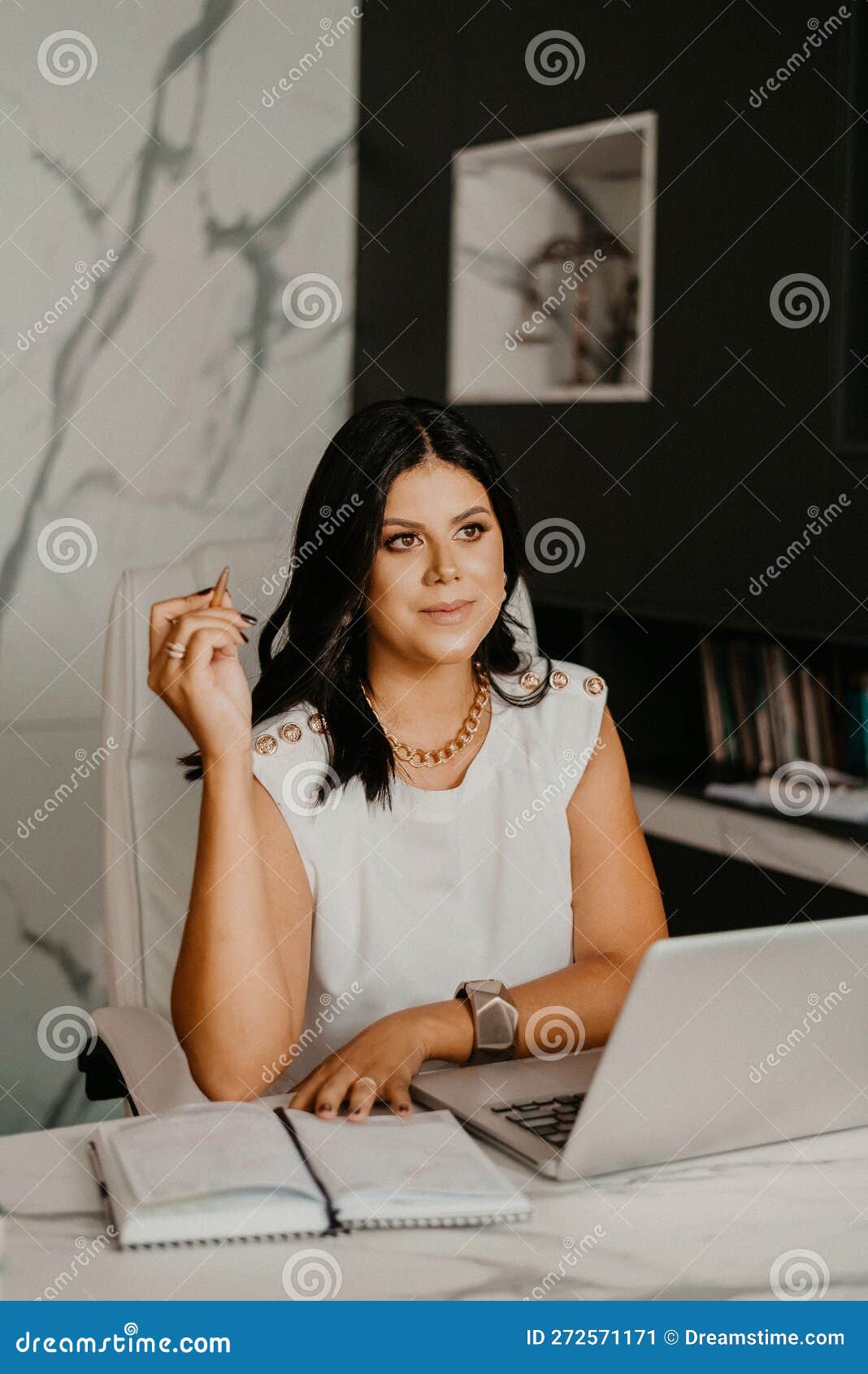 Female Professional at Her Home Office, Smiling with Contentment Stock