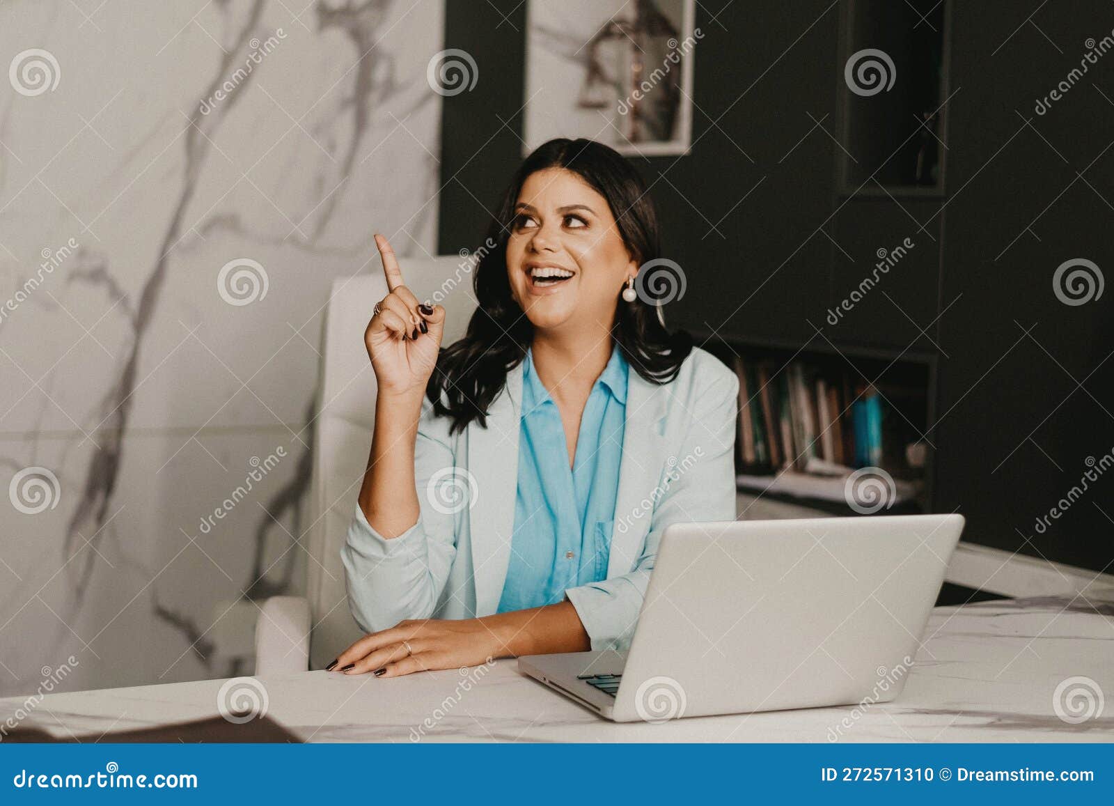 Female Professional at Her Home Office, Smiling with Contentment Stock