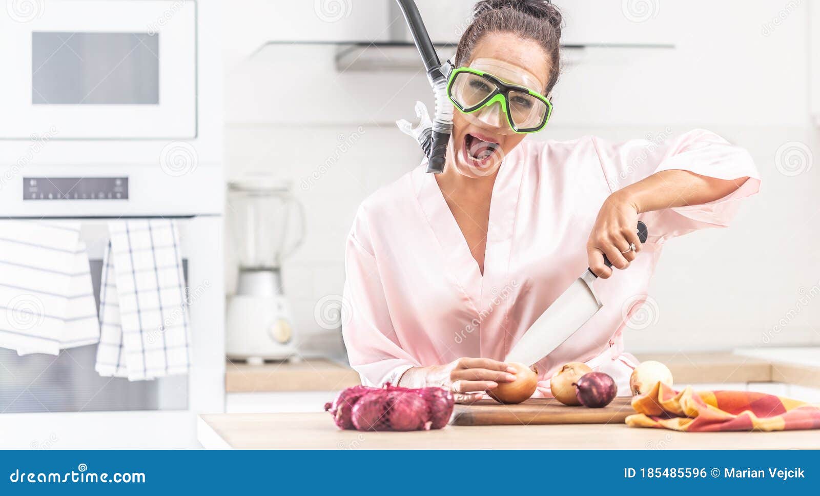 Female Protects Herself from Onion Cutting Smell by a Snorchel while ...