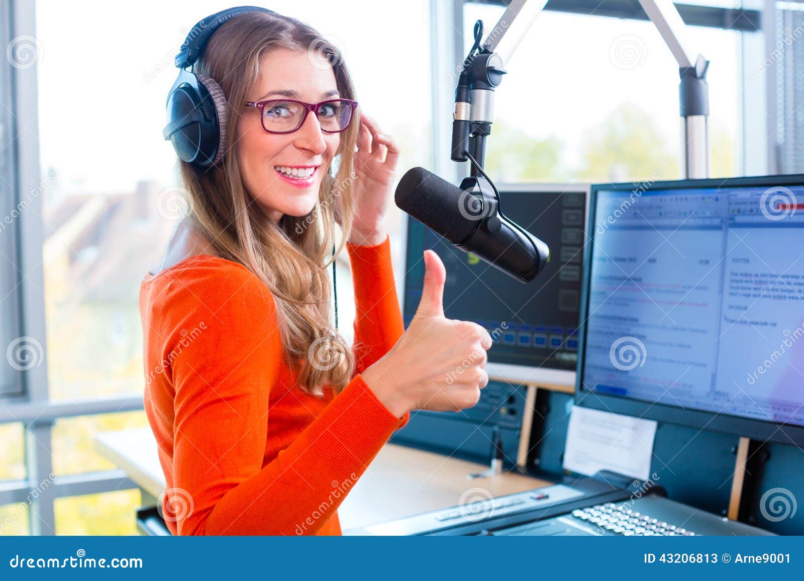 female radio presenter in radio station on air