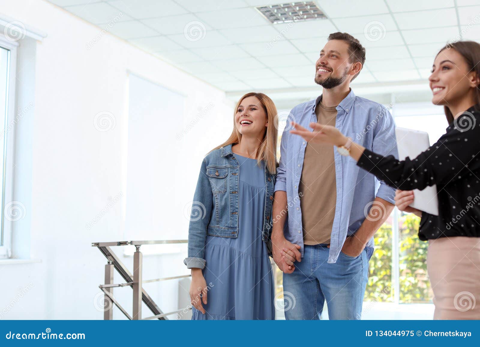 Female Real Estate Agent Showing New House To Couple Stock Image Image Of Caucasian 