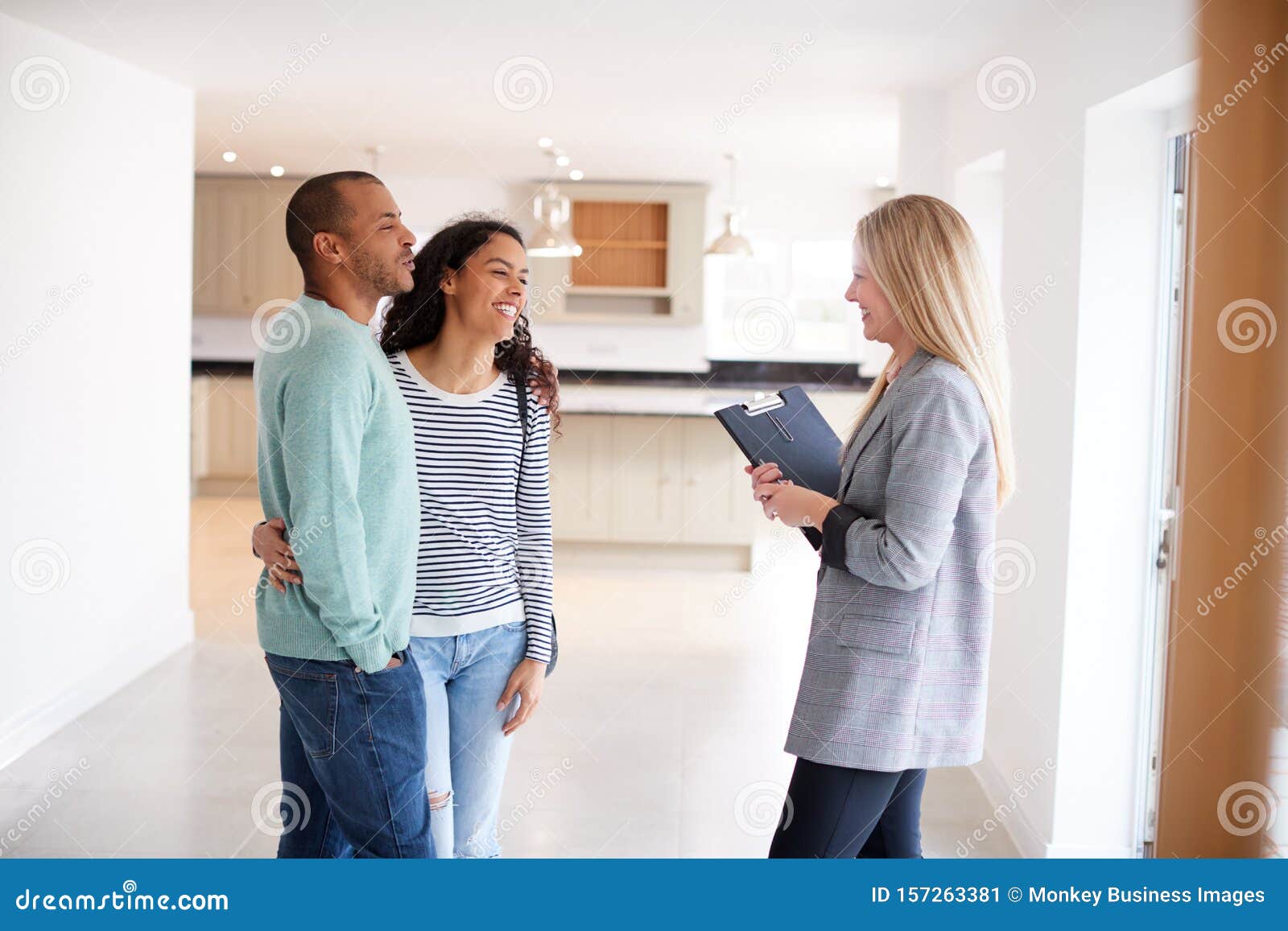 Female Realtor Showing Couple Interested In Buying Around House Stock Image Image Of Person 