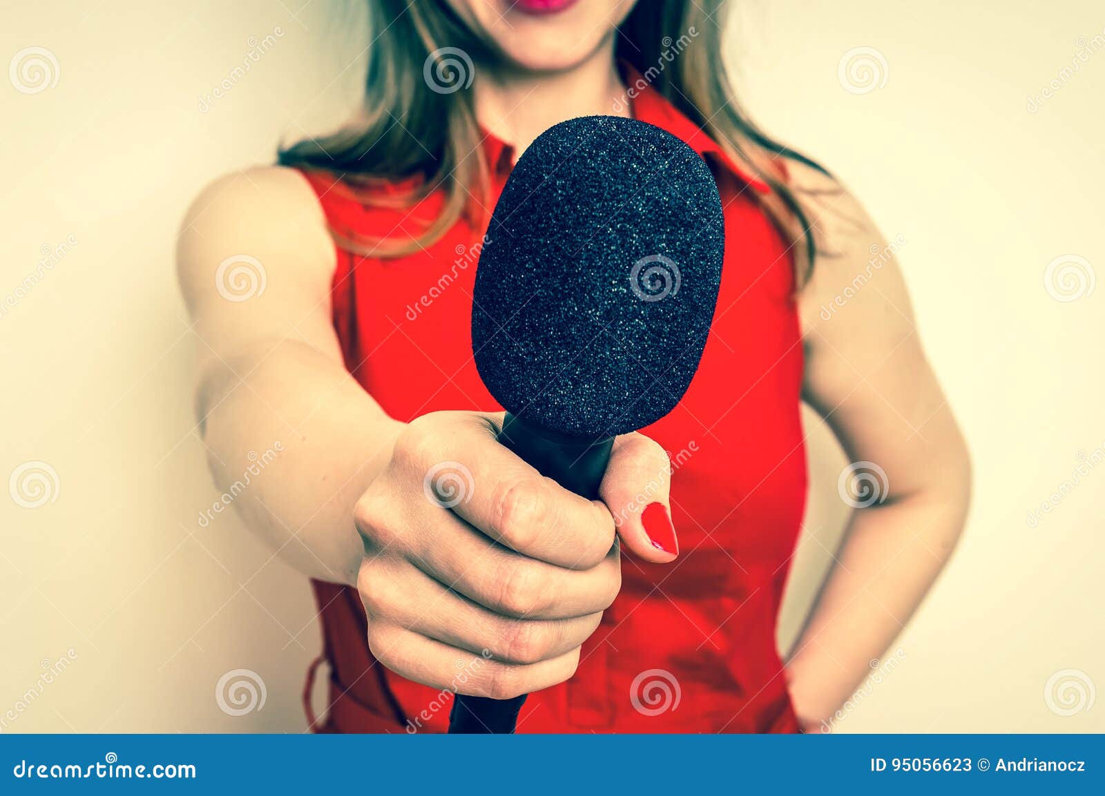 female reporter with black microphone making interview