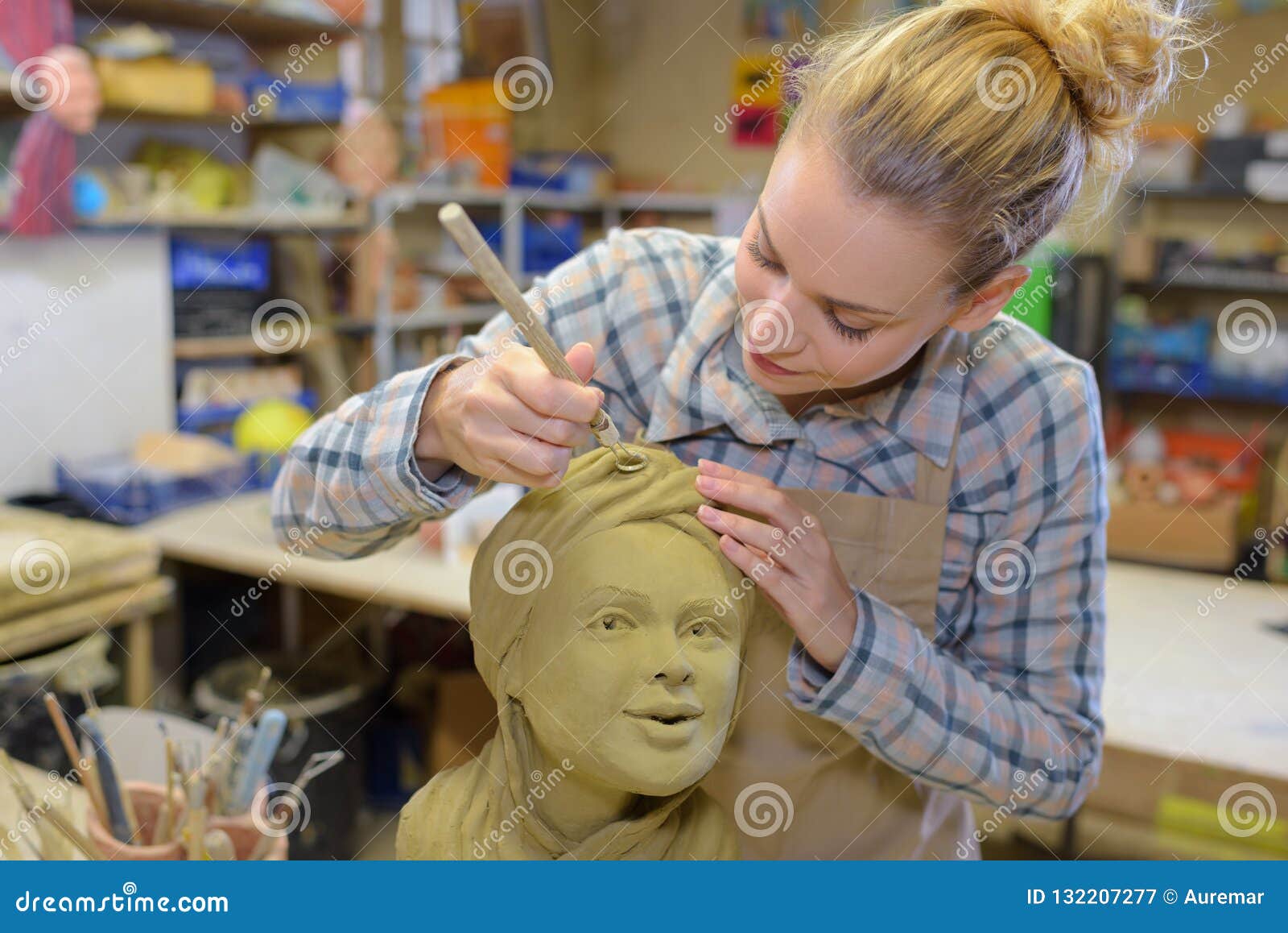 female sculptor at work
