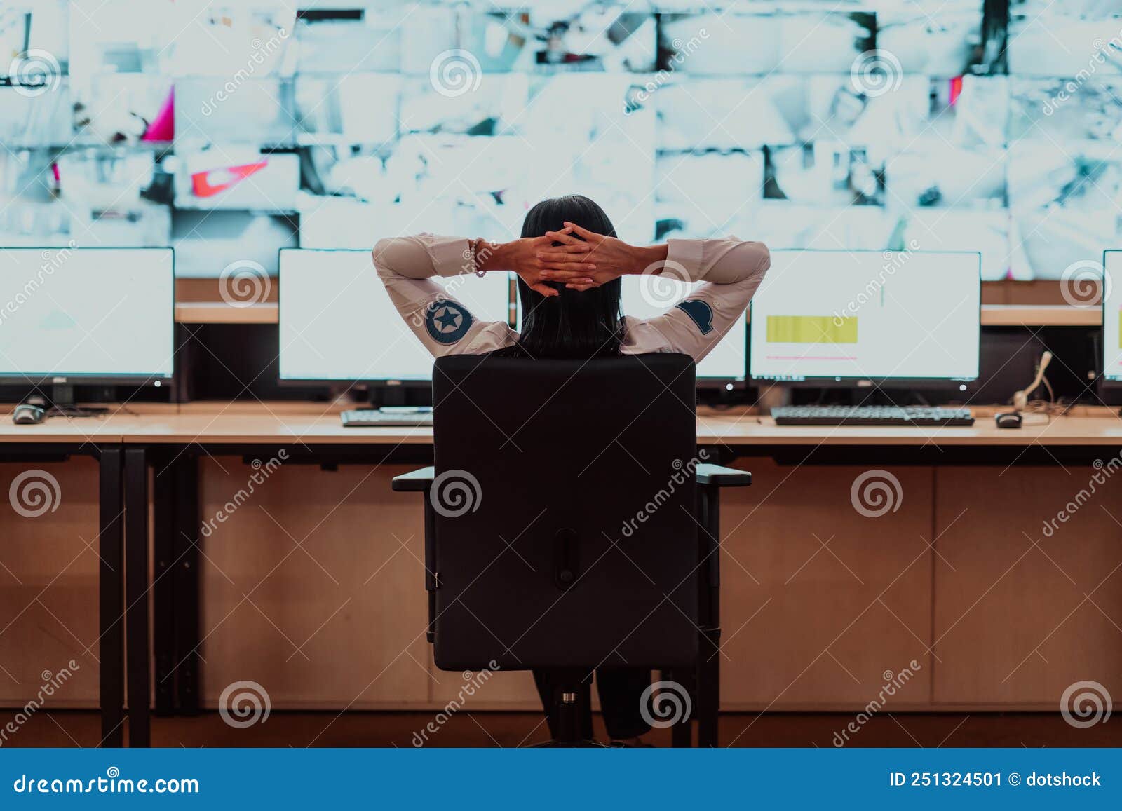 Female Security Operator Working in a Data System Control Room Offices