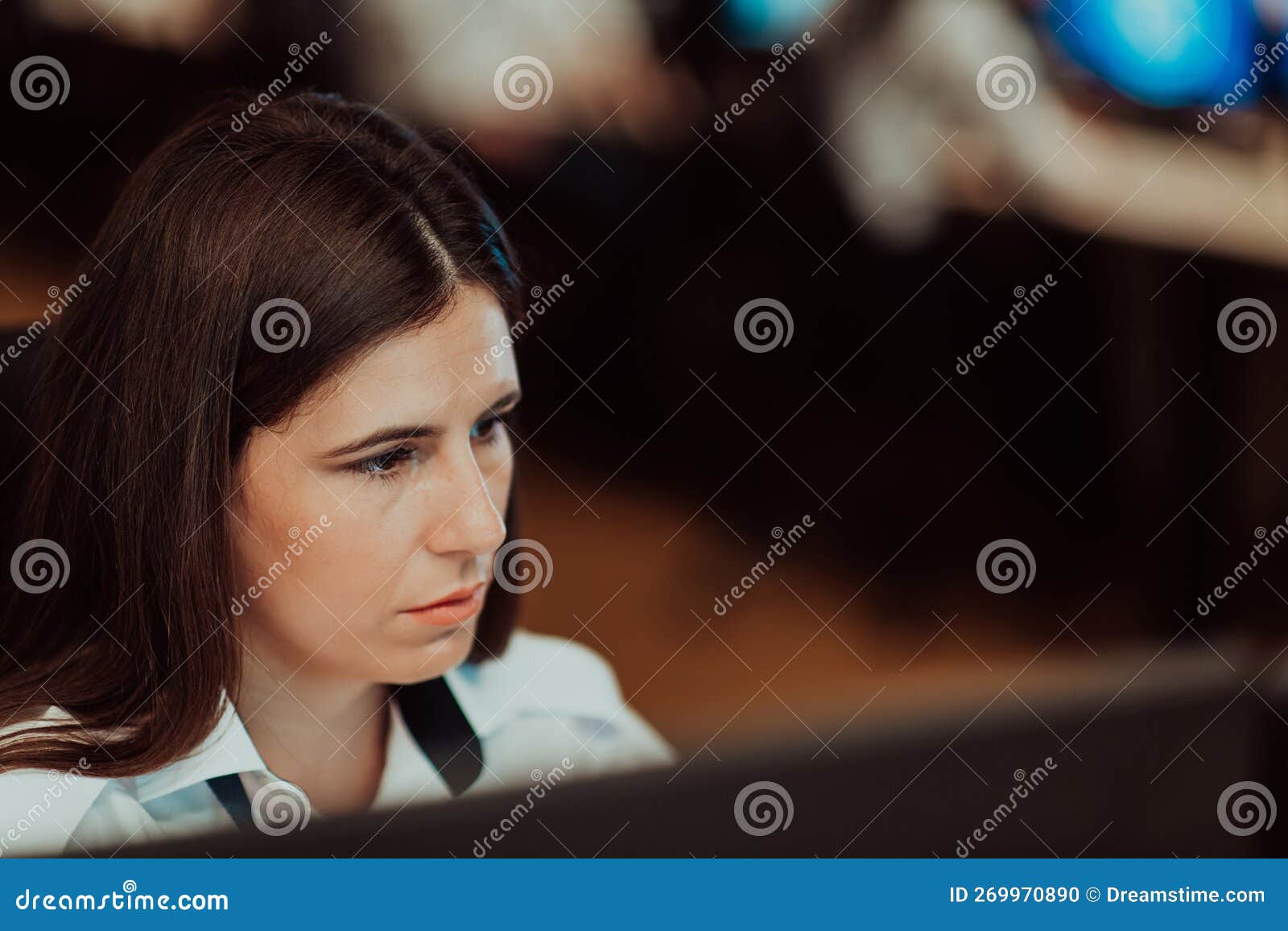 Female Security Operator Working in a Data System Control Room Offices