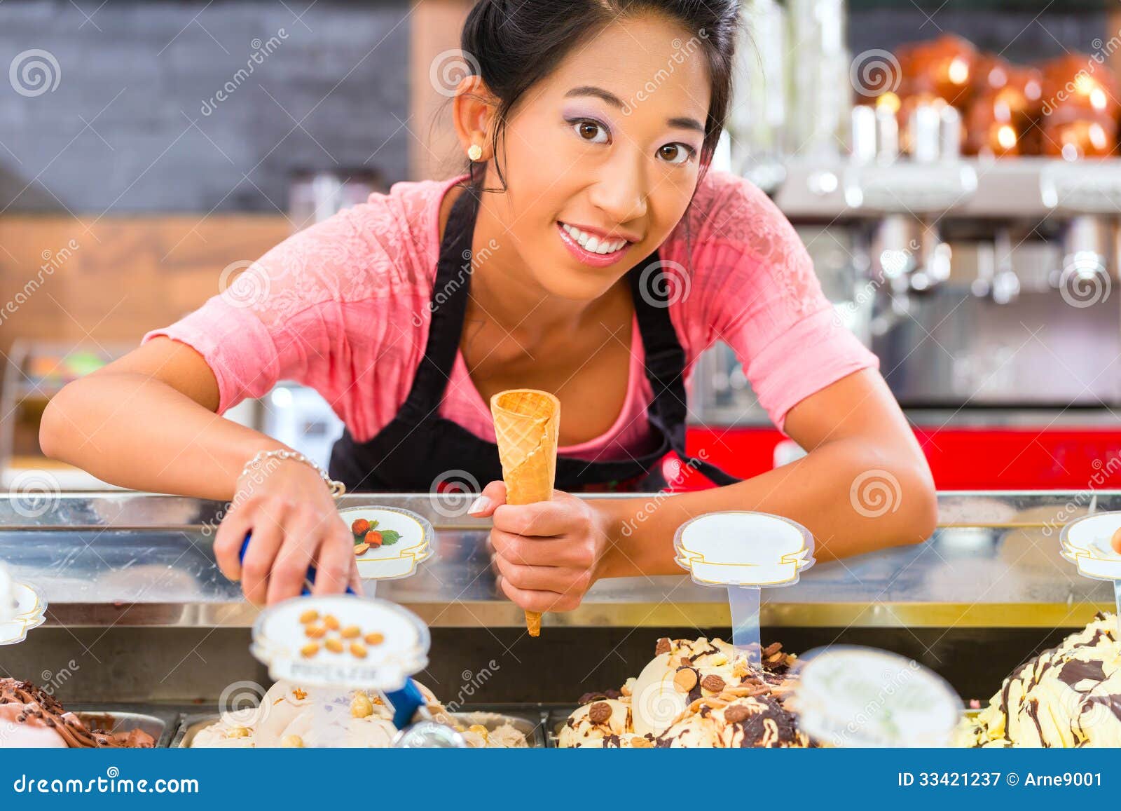 female seller in parlor with ice cream cone