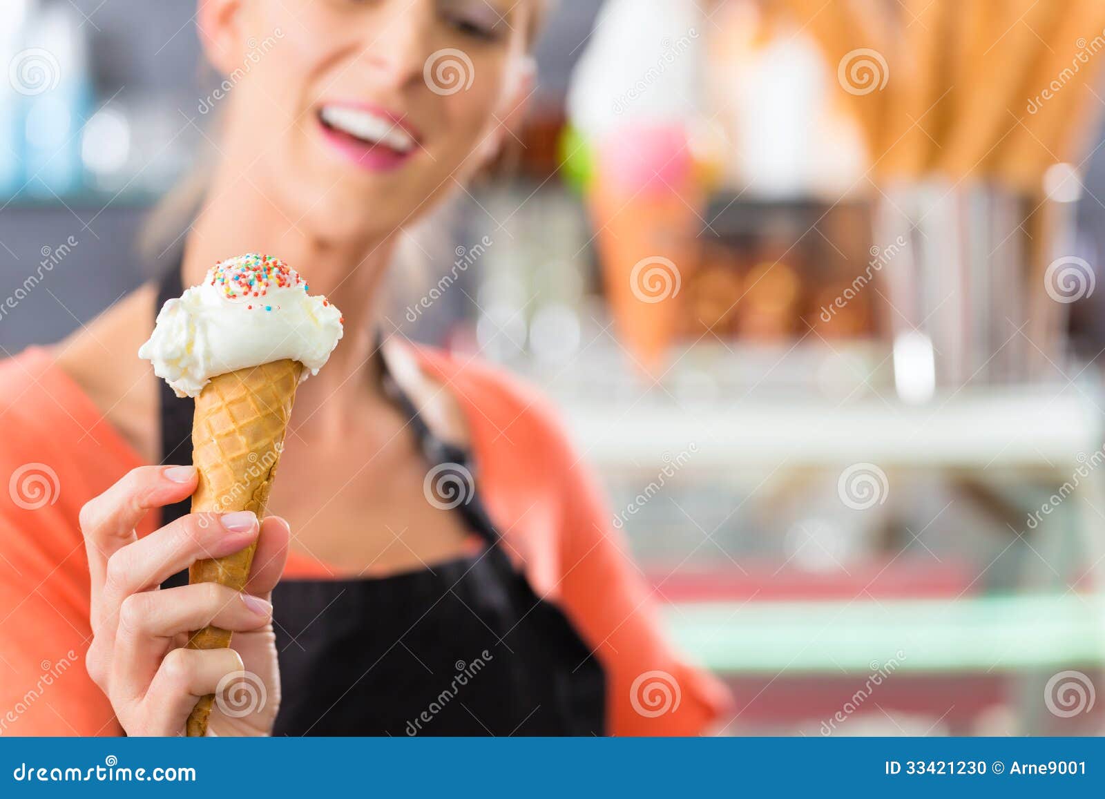 female seller in parlor with ice cream cone