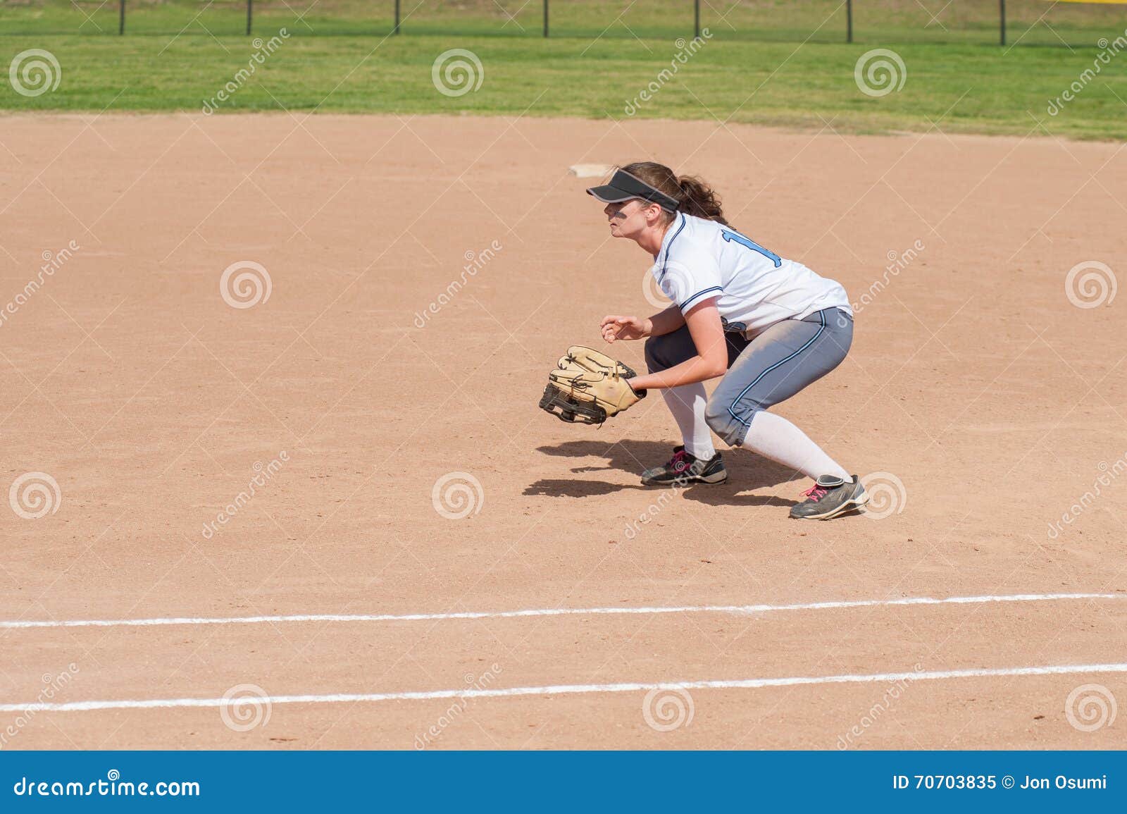 female softball player in ready position