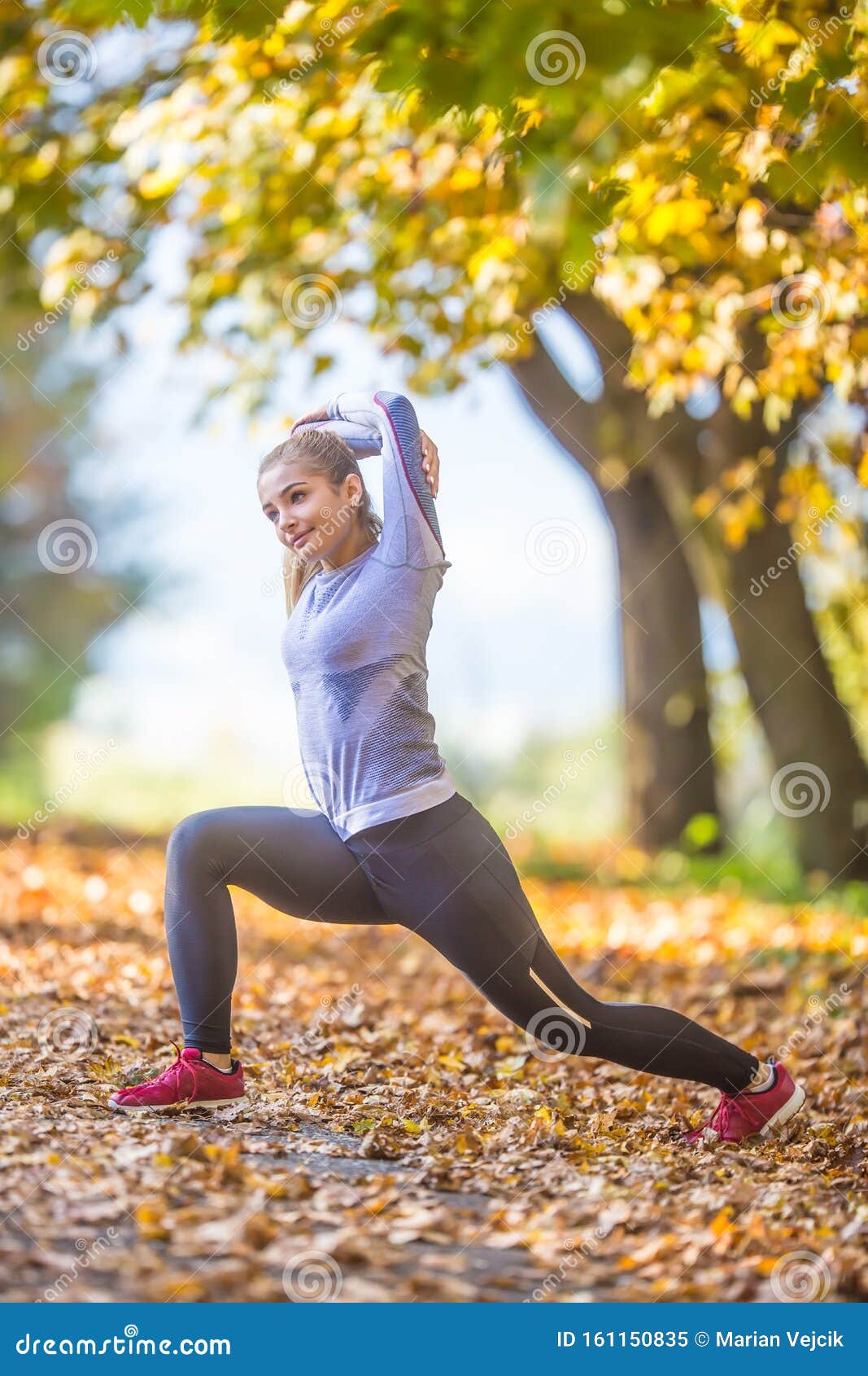 Female Sporty Young Woman Doing Stretching or Warming the Body and