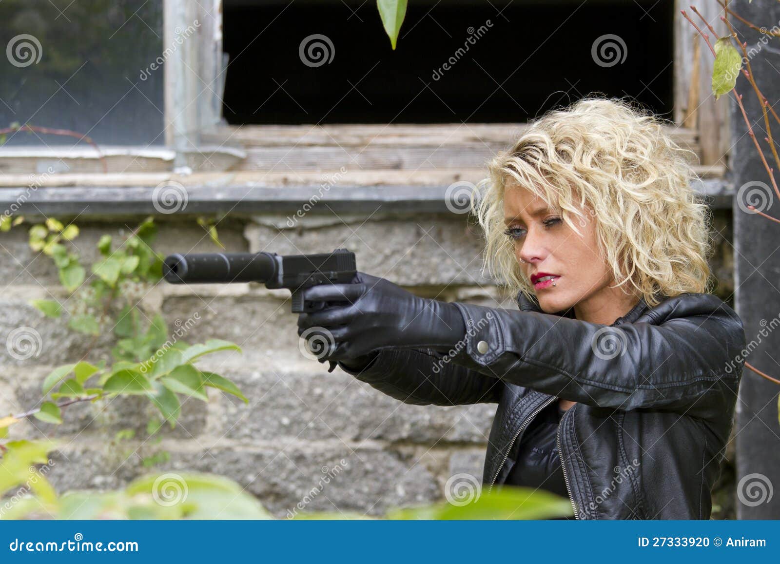 female spy with silencer handgun