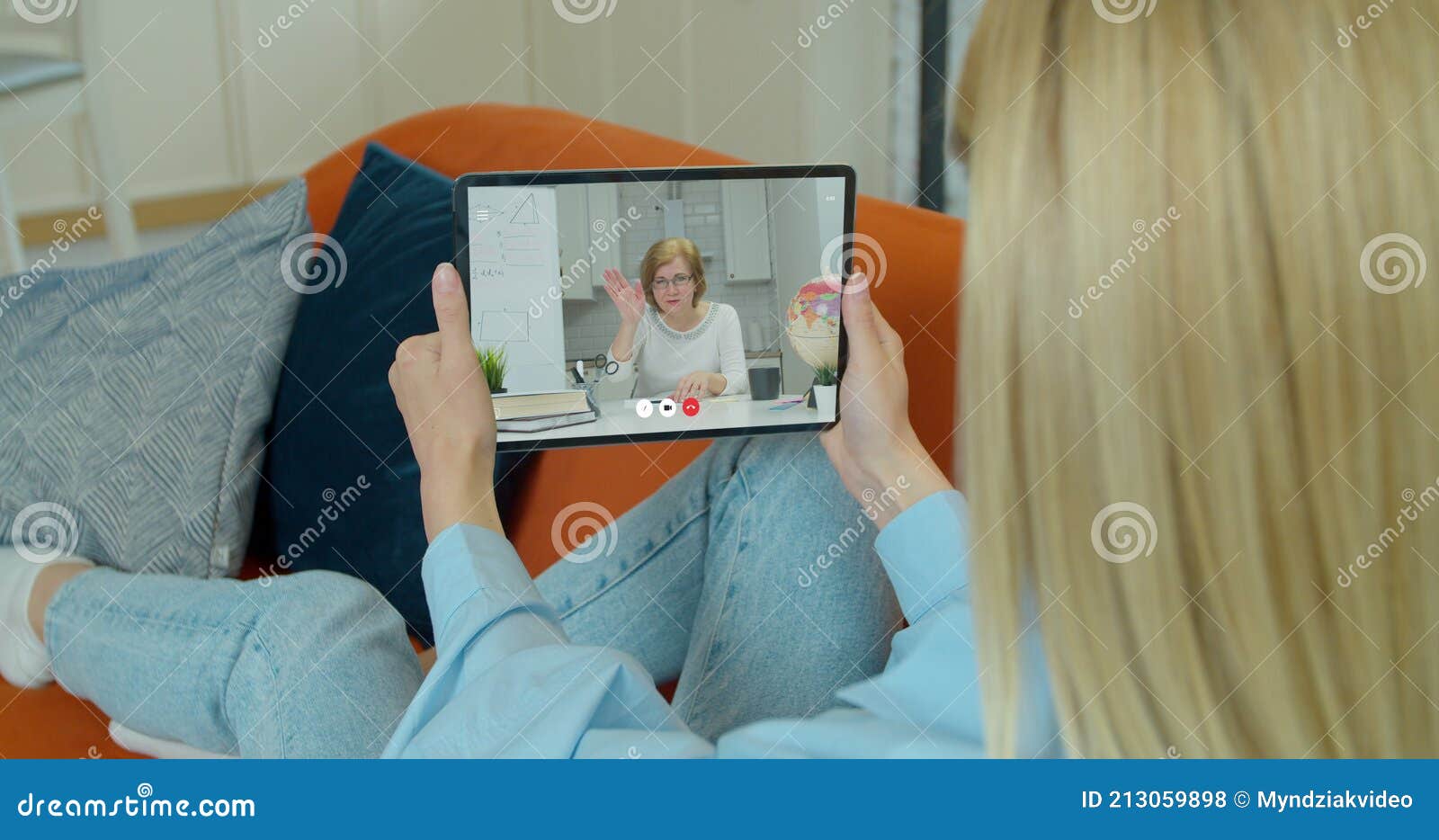 female student makes conference video call on tabletpc computer talks with web tutor, online teacher in remote webcam