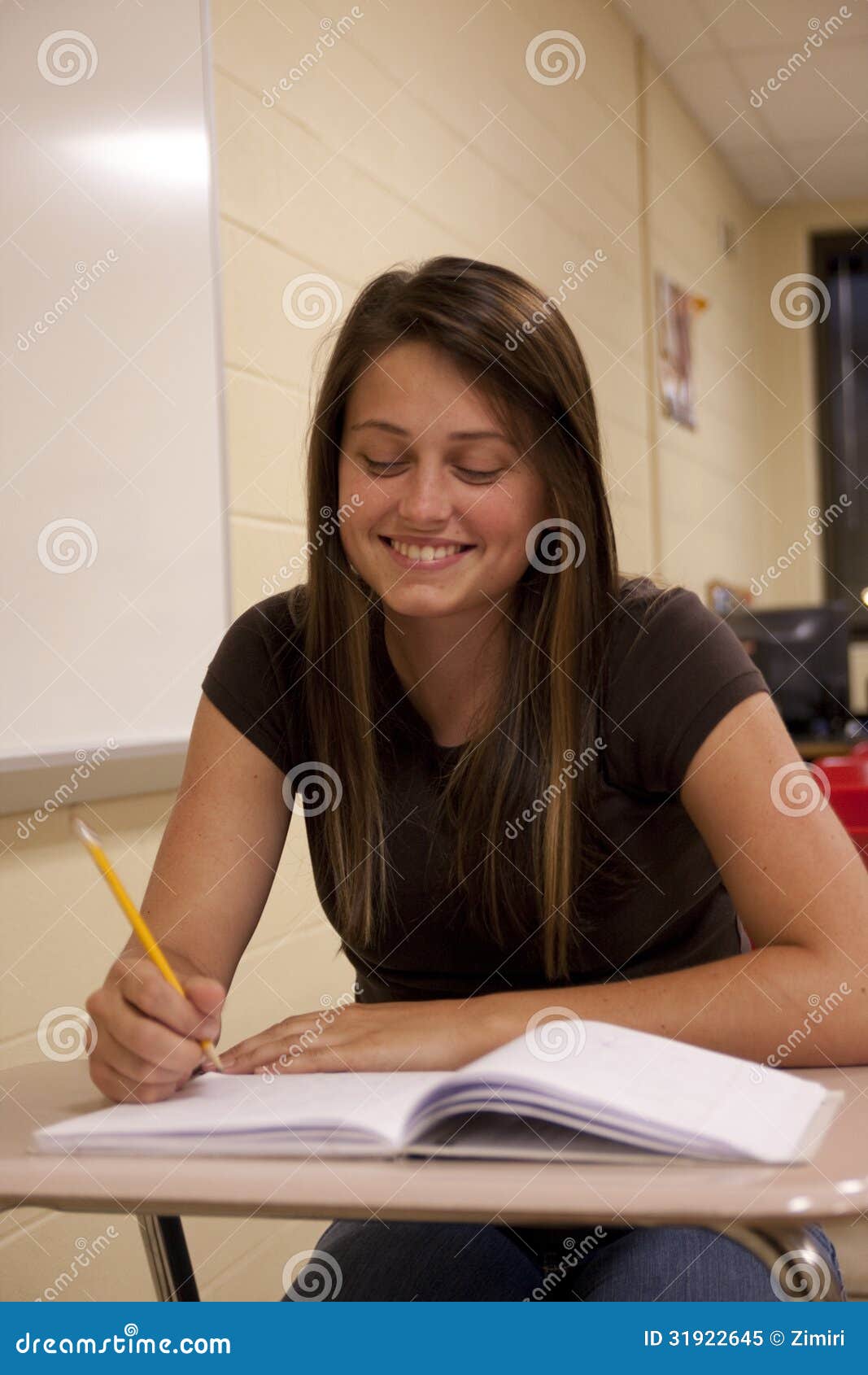 Female Student Smiling at Her Desk Stock Image Image of looking, concentration 31922645