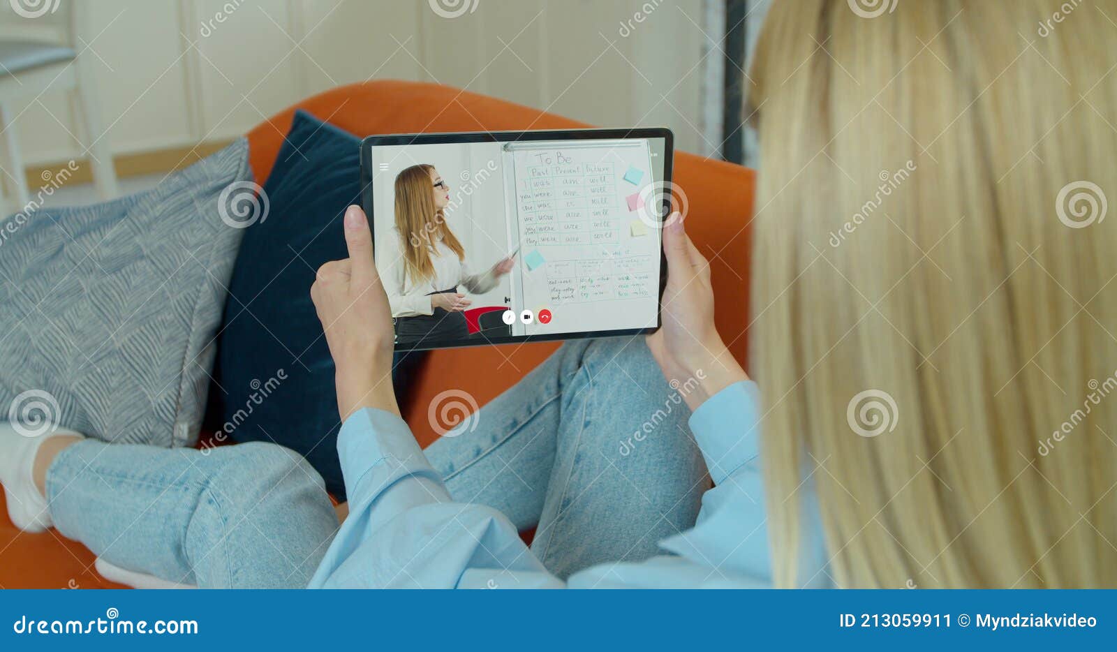female student is studies by internet video lesson with teacher using tabletpc at home. e-learning classe or webinar at