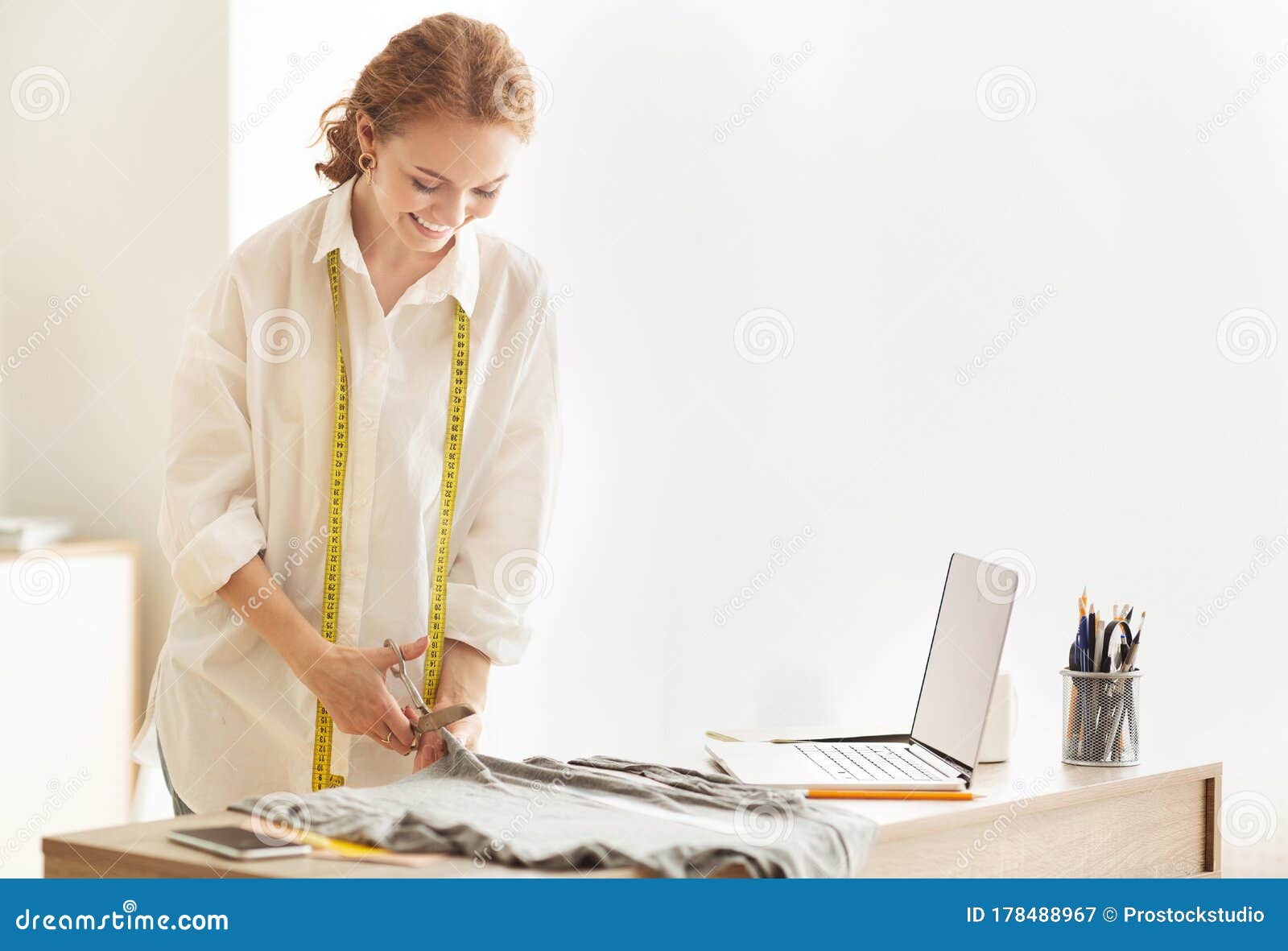 Female Tailor Cutting Fabric with Scissors, Sewing Costume Stock Image ...