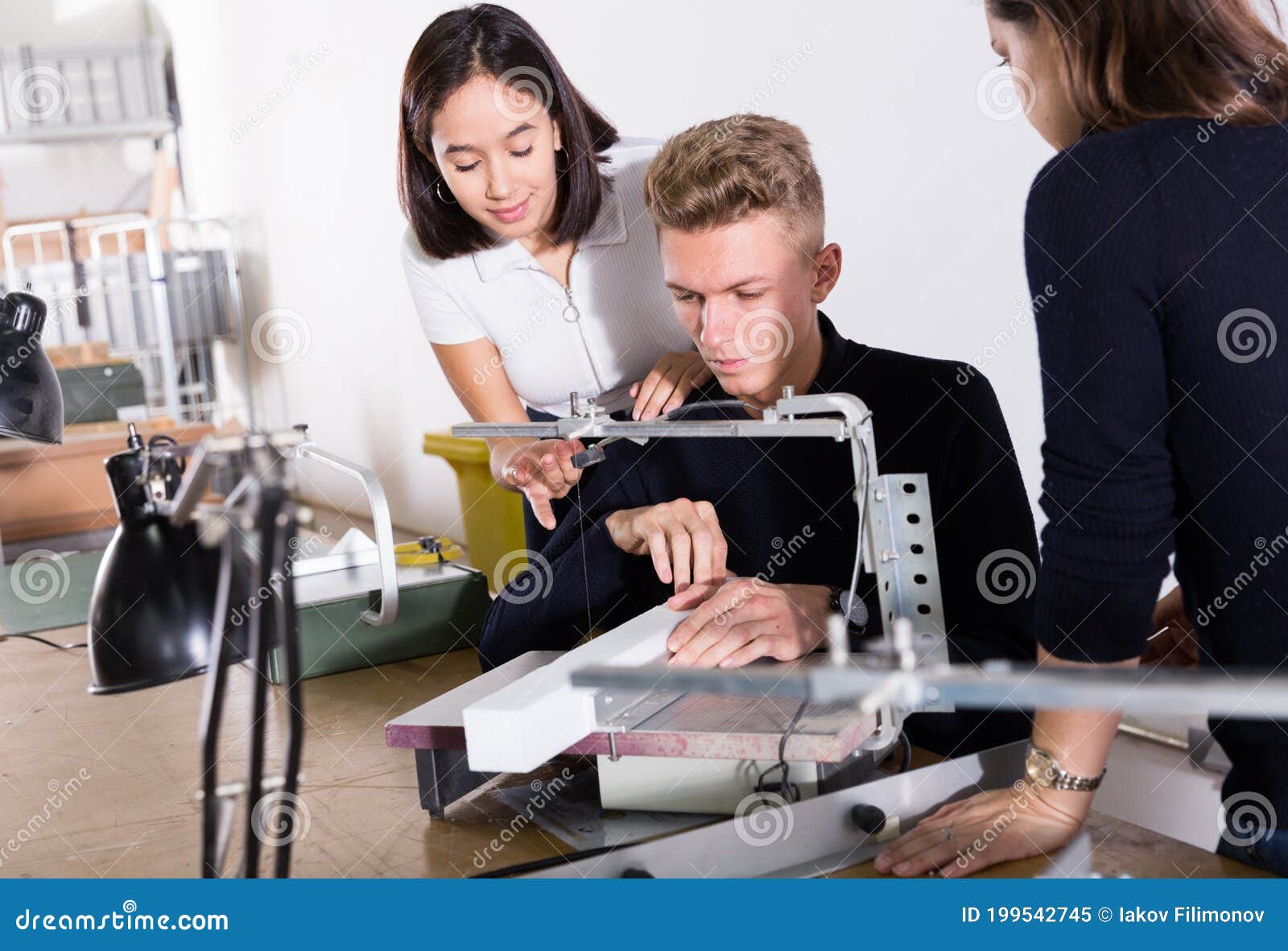 Female Teacher Controlling Work of Students on Scroll Saw Stock Image ...