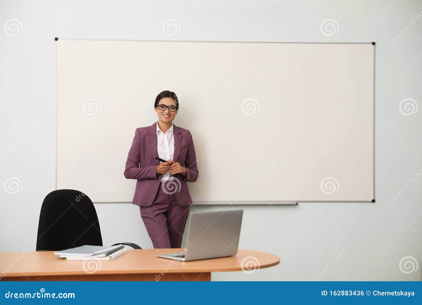 Female Teacher Near Whiteboard in Classroom Stock Photo Image of
