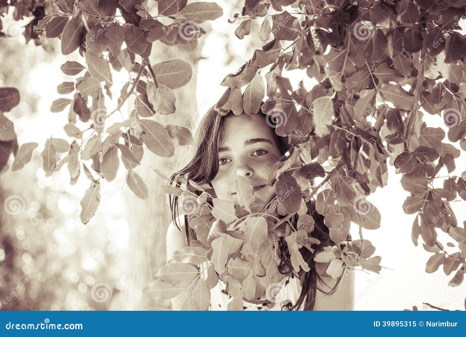 Female Teenager Behind Some Leafs Stock Image - Image of teen, hidden ...