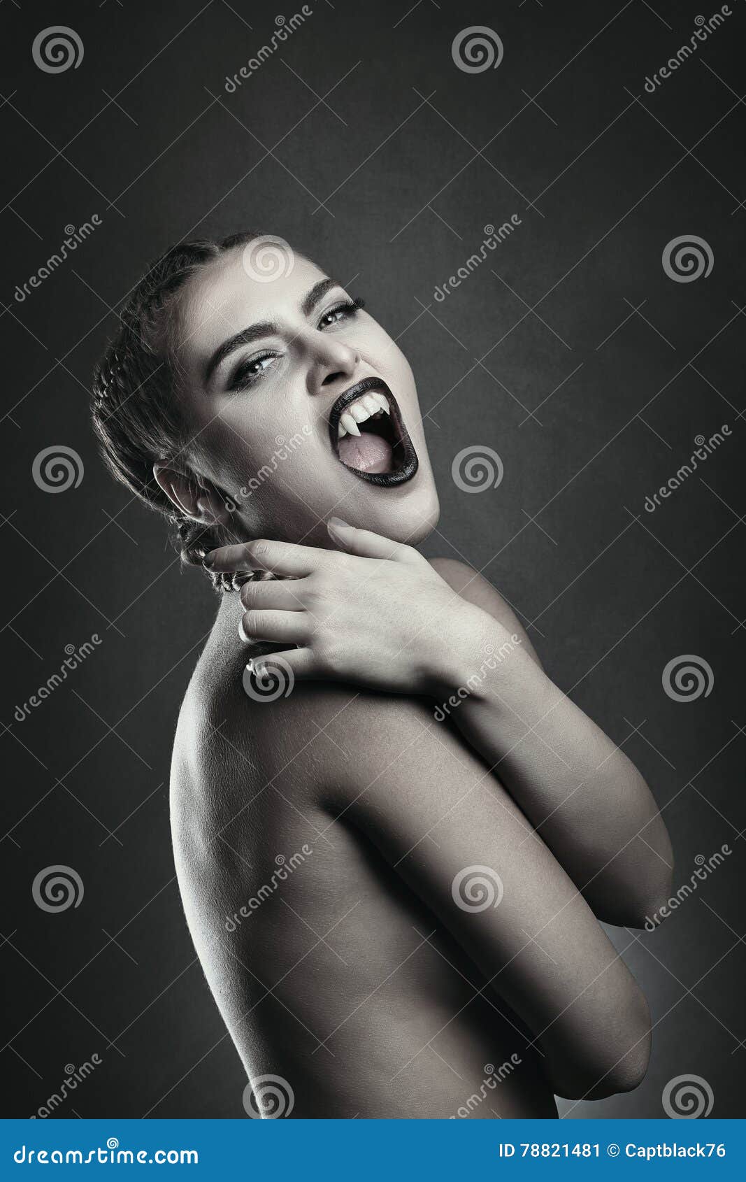 female vampire showing fangs