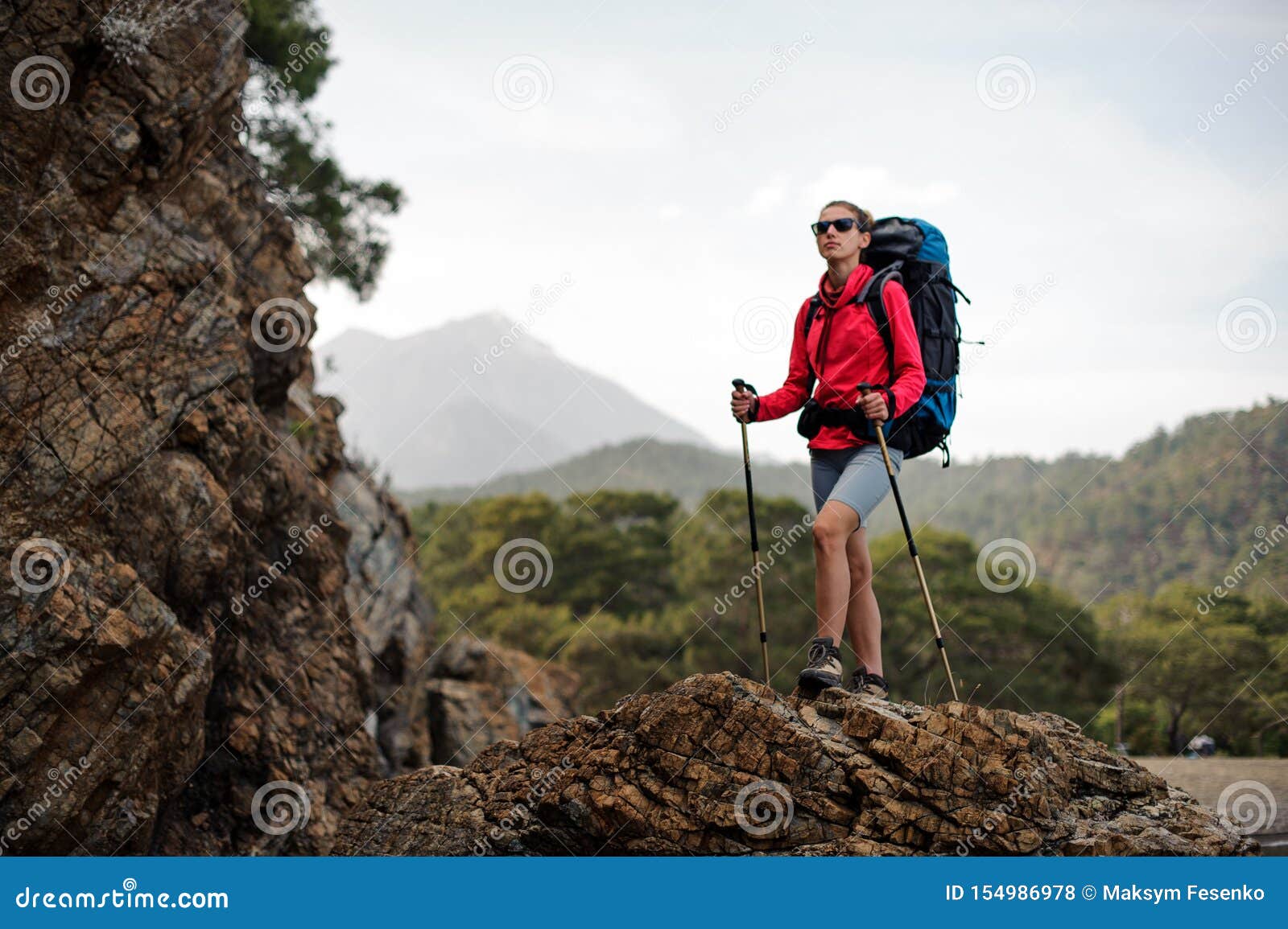 Hiker poses on the side Stock Photos and Images | agefotostock