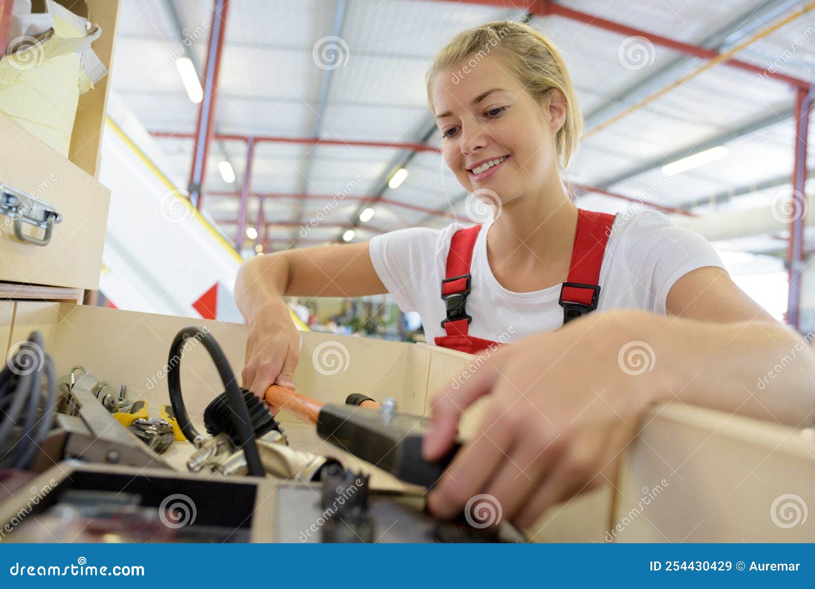 Female Worker Connecting Battery in Industrial Warehouse Stock Image ...