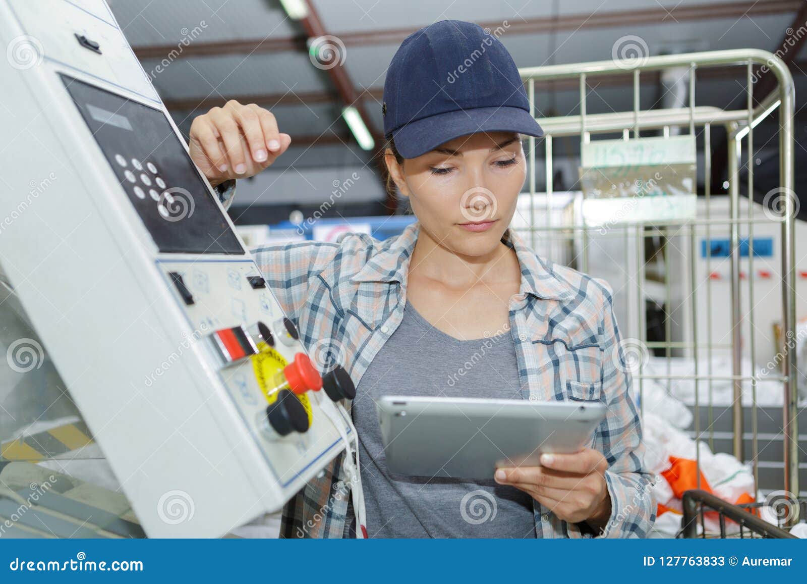 Female Worker Using Digital Tablet in Manufacturing Industry Stock